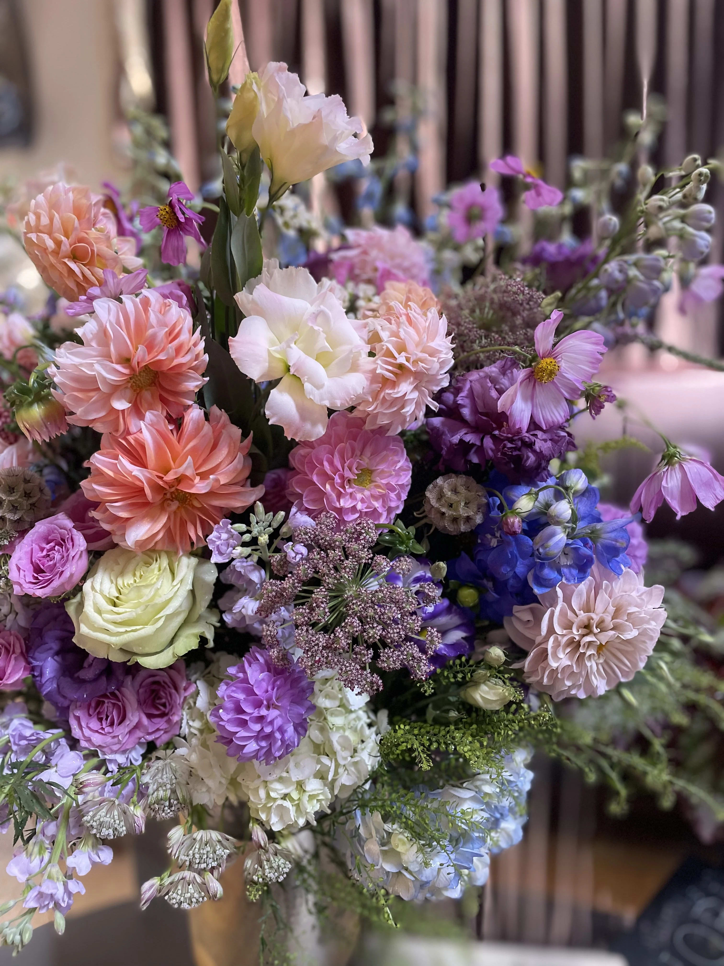 Mixed bouquet of pink, purple, blue, and white flowers