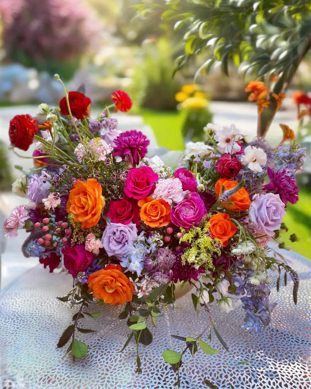 Colorful mixed bouquet of roses and assorted flowers on a table
