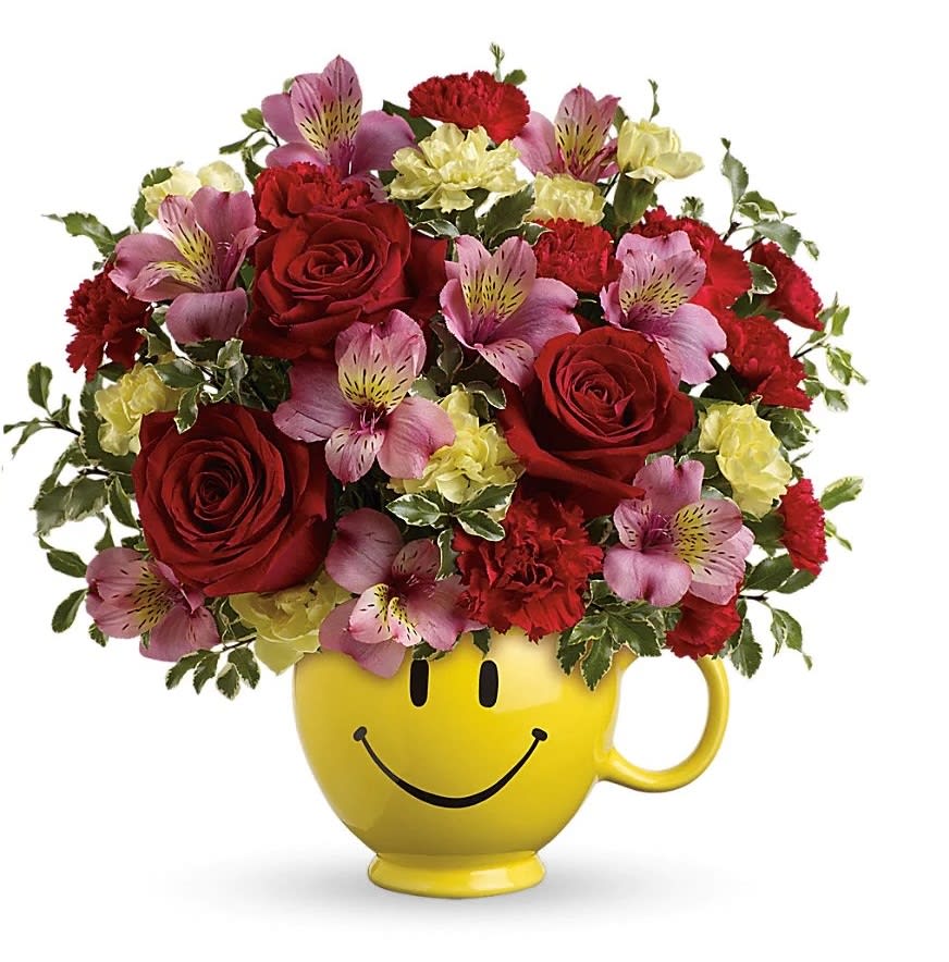 So Happy You're Mine Bouquet - Send smiles across the miles with this magnificent mug of blooms! Sure to become their favorite for morning coffee, this sweet ceramic design brims with lush red roses, pink alstroemeria and miniature red and yellow carnations. It's a great way to send your love! This bouquet features red roses, pink alstroemeria, miniature red carnations, miniature light yellow carnations and pitta negra. Delivered in a Be Happy® Mug.