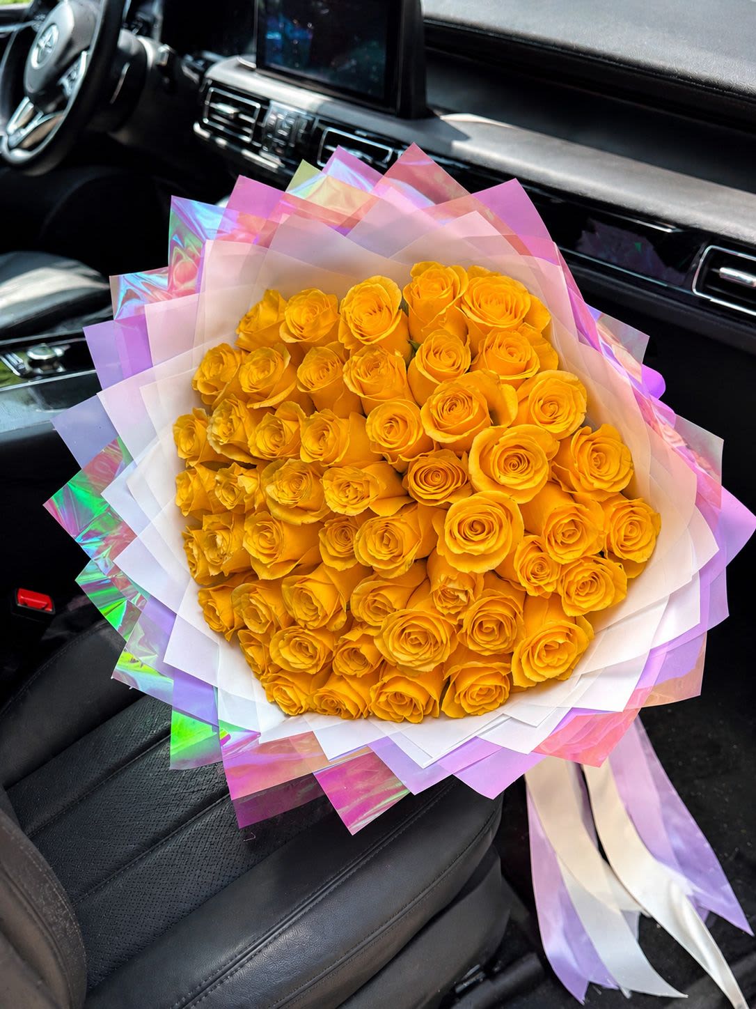 Golden Sunset Luxury Rose Bouquet (50 Orange Roses) -  Bright, bold, and unforgettable. Our Golden Sunset Luxury Rose Bouquet features 50 vibrant orange roses wrapped in elegant iridescent Korean floral paper.  Orange roses symbolize:  Passion  Energy  Success  New Beginnings  Perfect for:  * Graduation Flowers * Congratulations Bouquet * Birthday Flowers * Promotion Gift * Housewarming Flowers