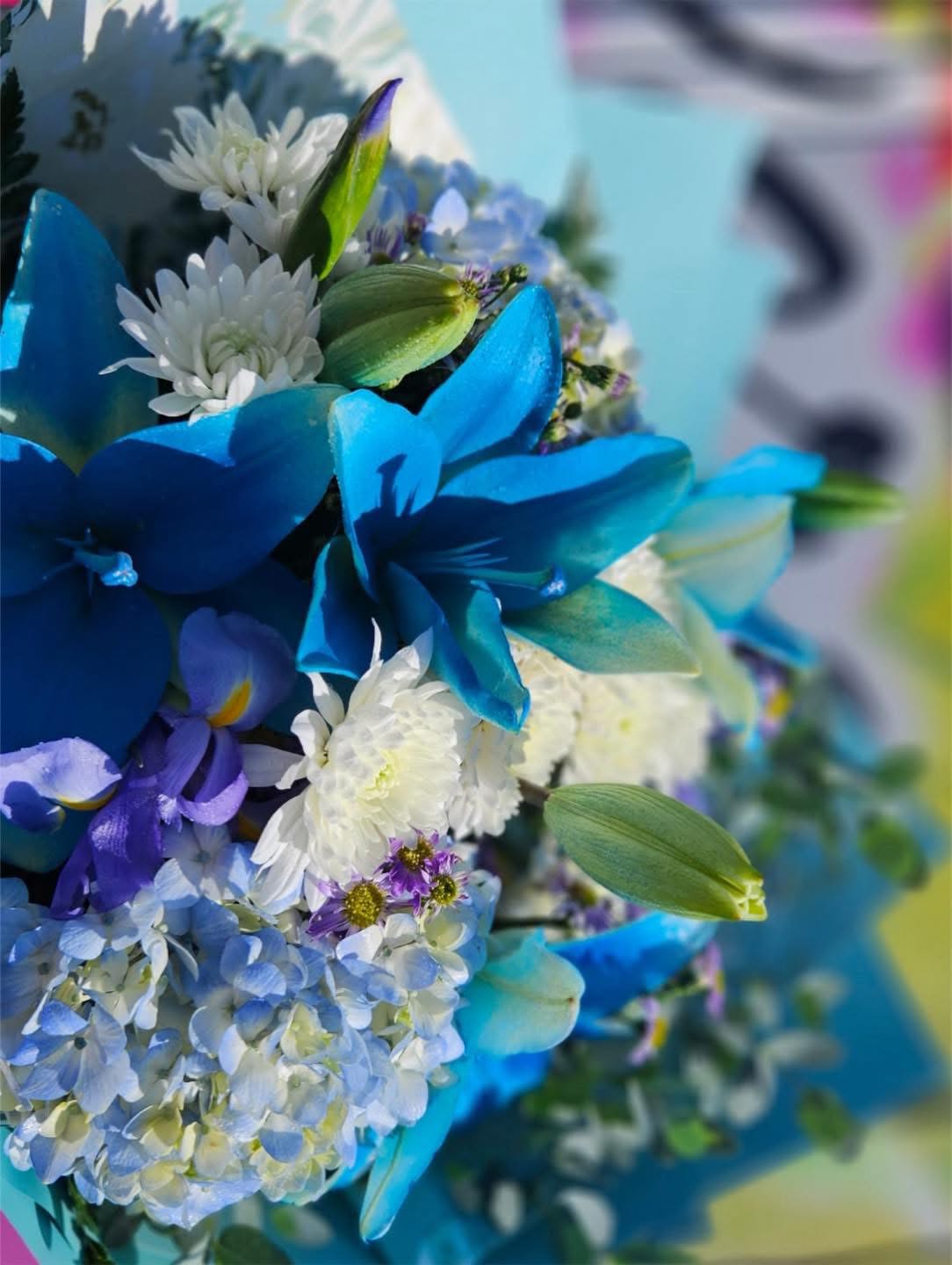 Blue and white bouquet with daisies and hydrangeas