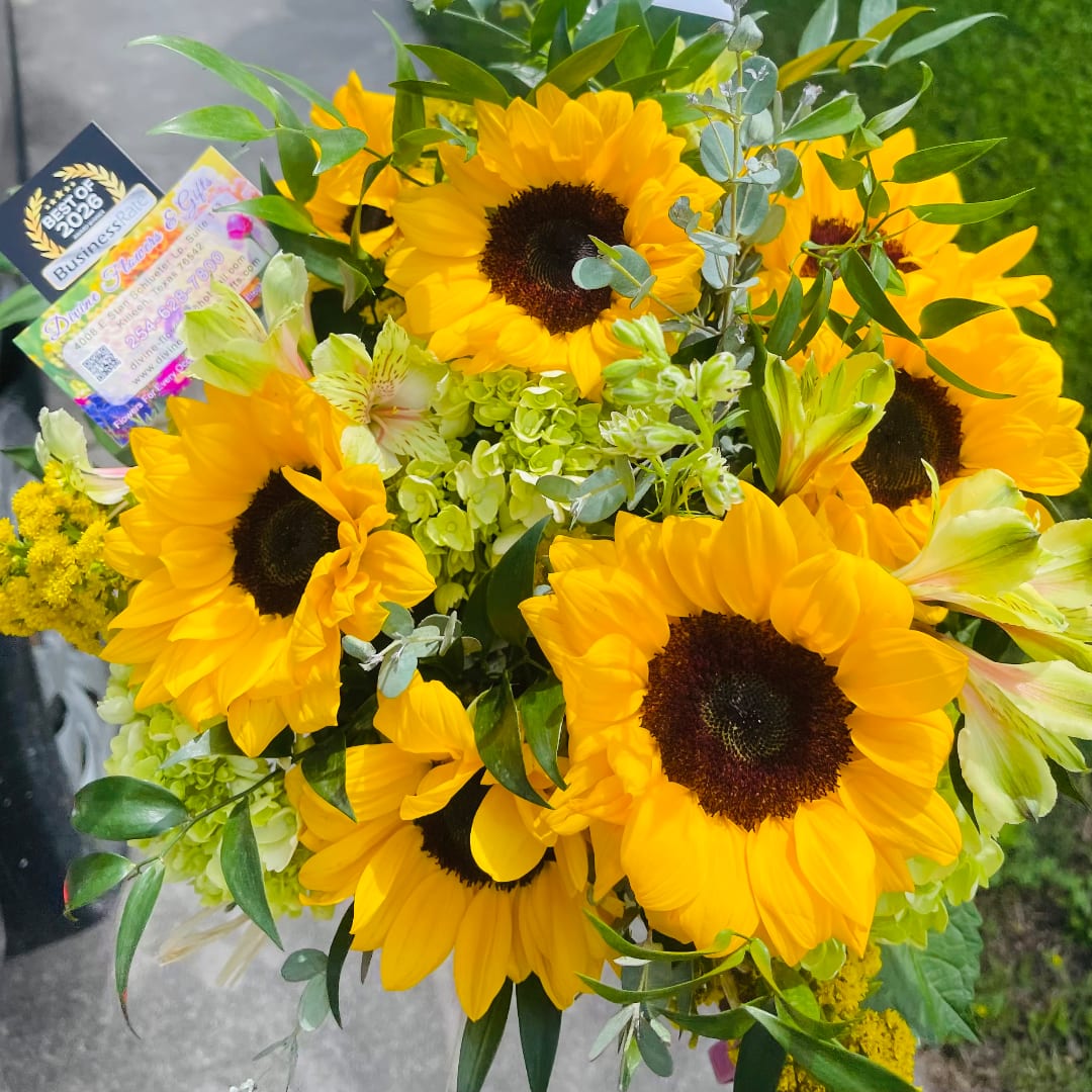 Bouquet of sunflowers with mixed greenery and pale alstroemeria