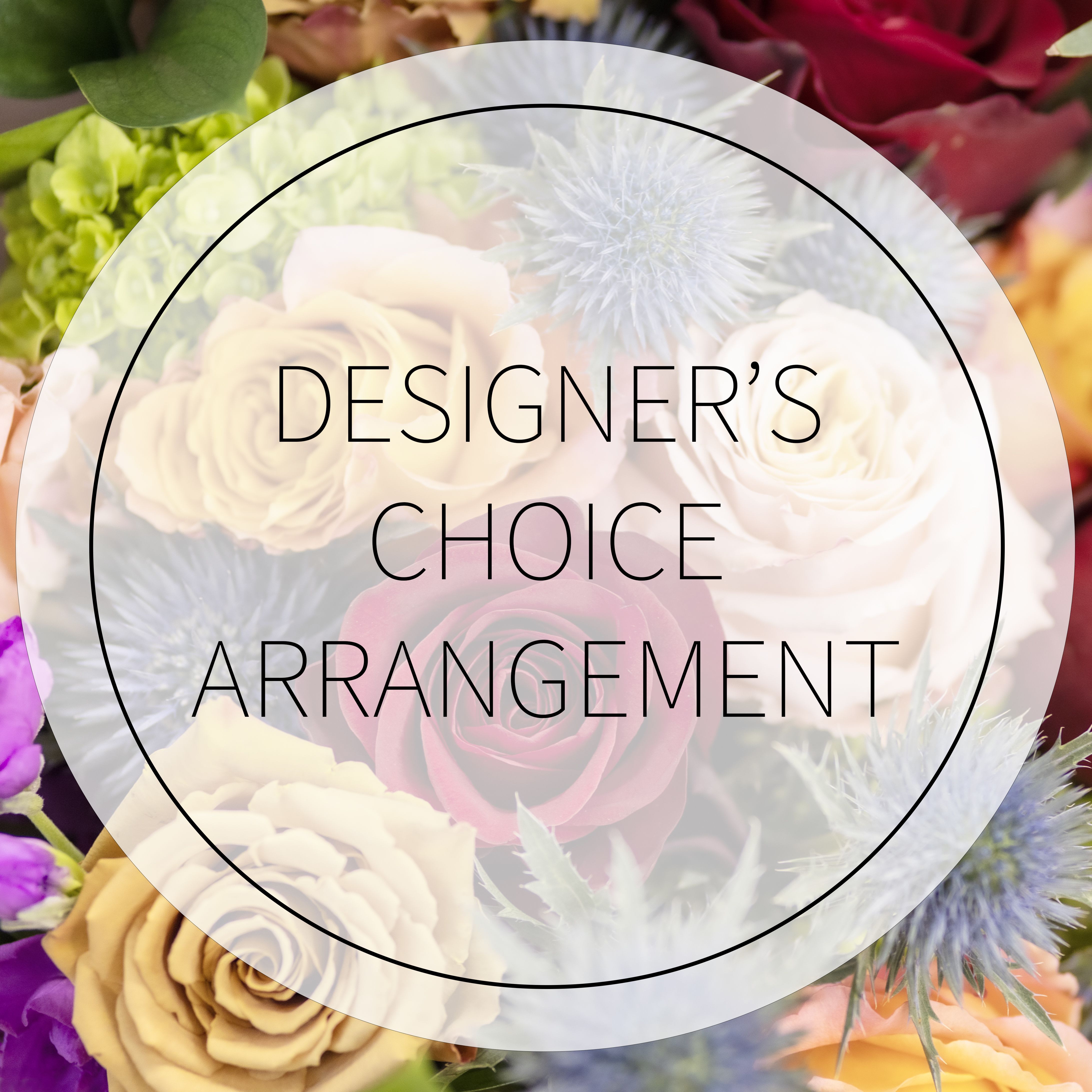 Designer’s choice floral arrangement with roses and thistle-like blooms