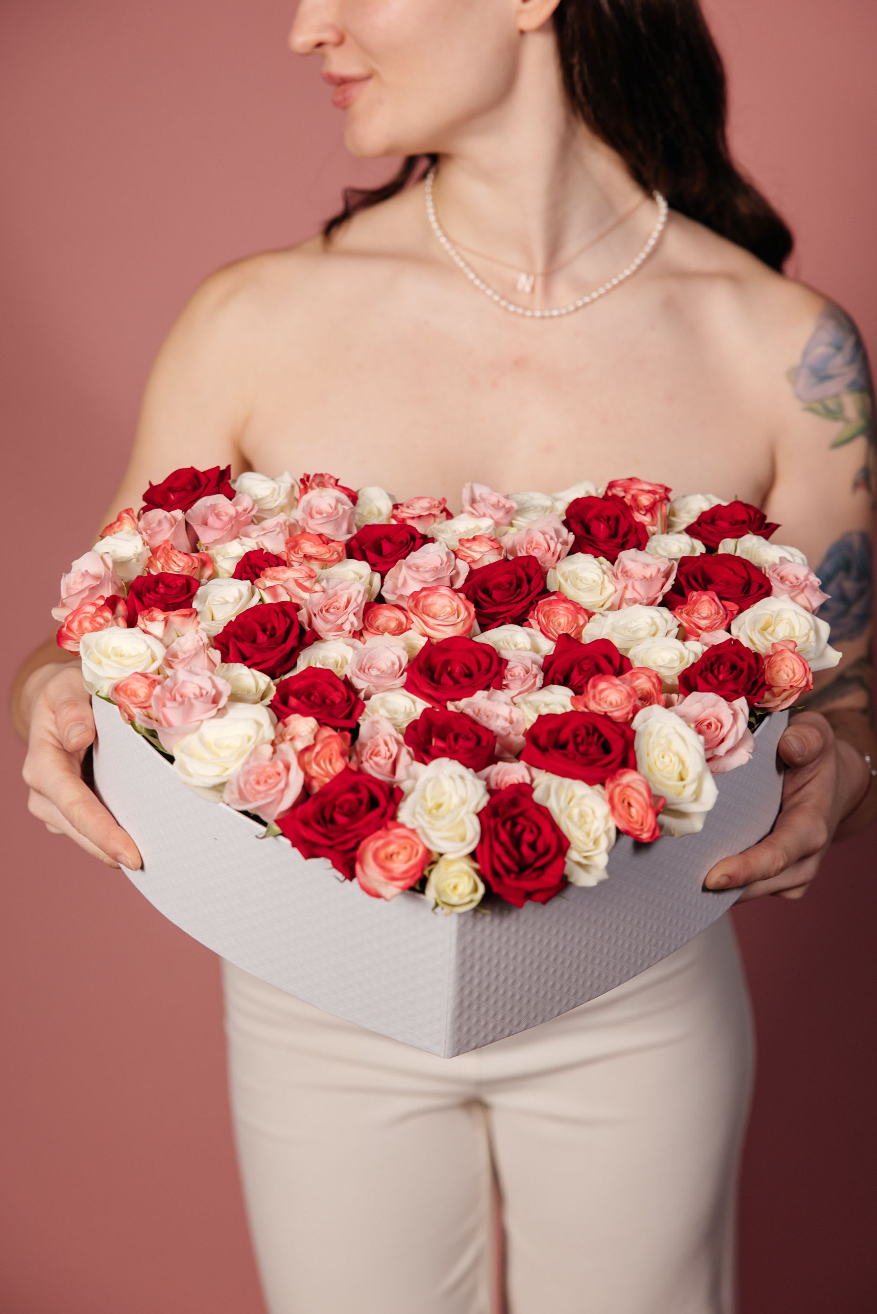 Heart-shaped box of red, pink, and white roses