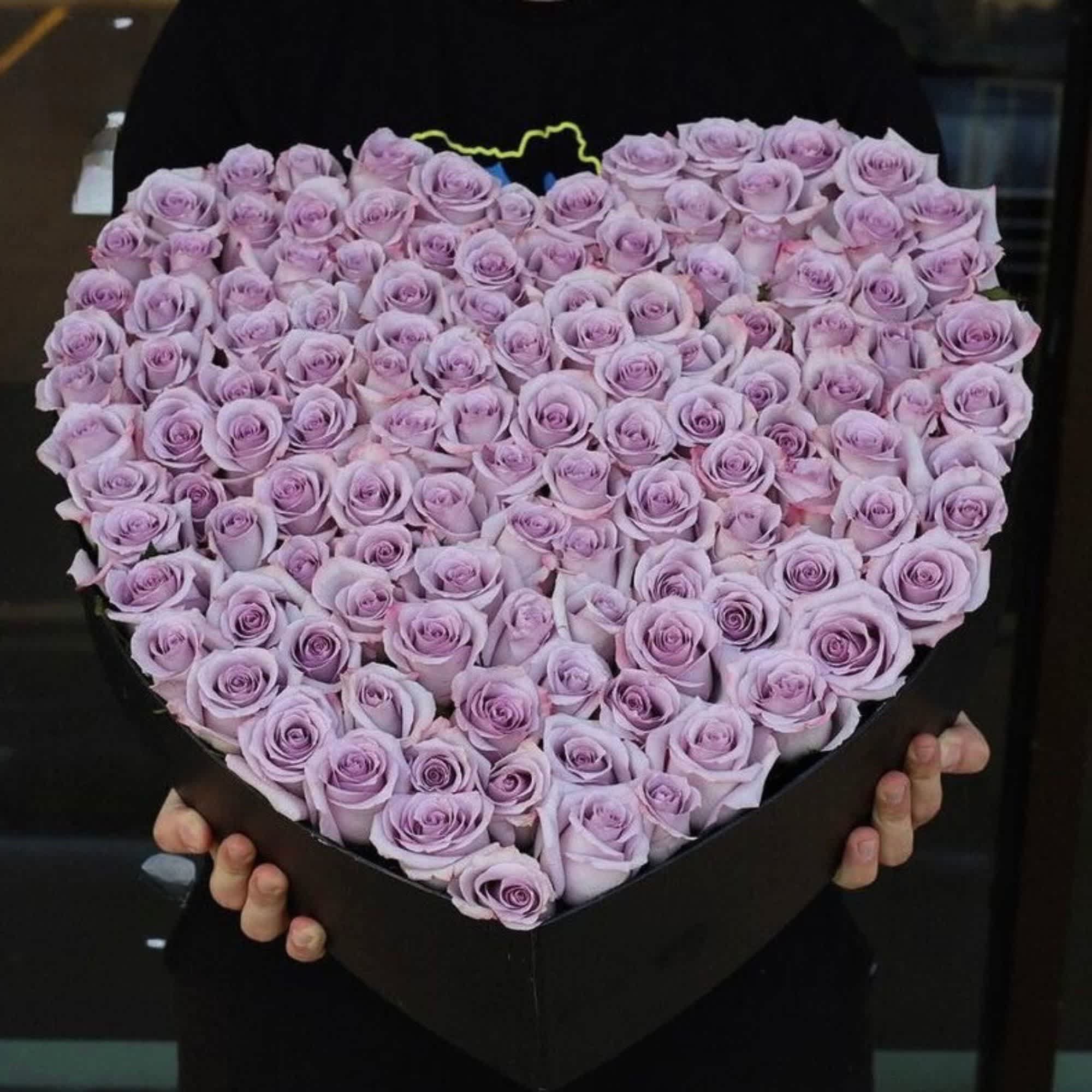 Heart-shaped box filled with lavender roses