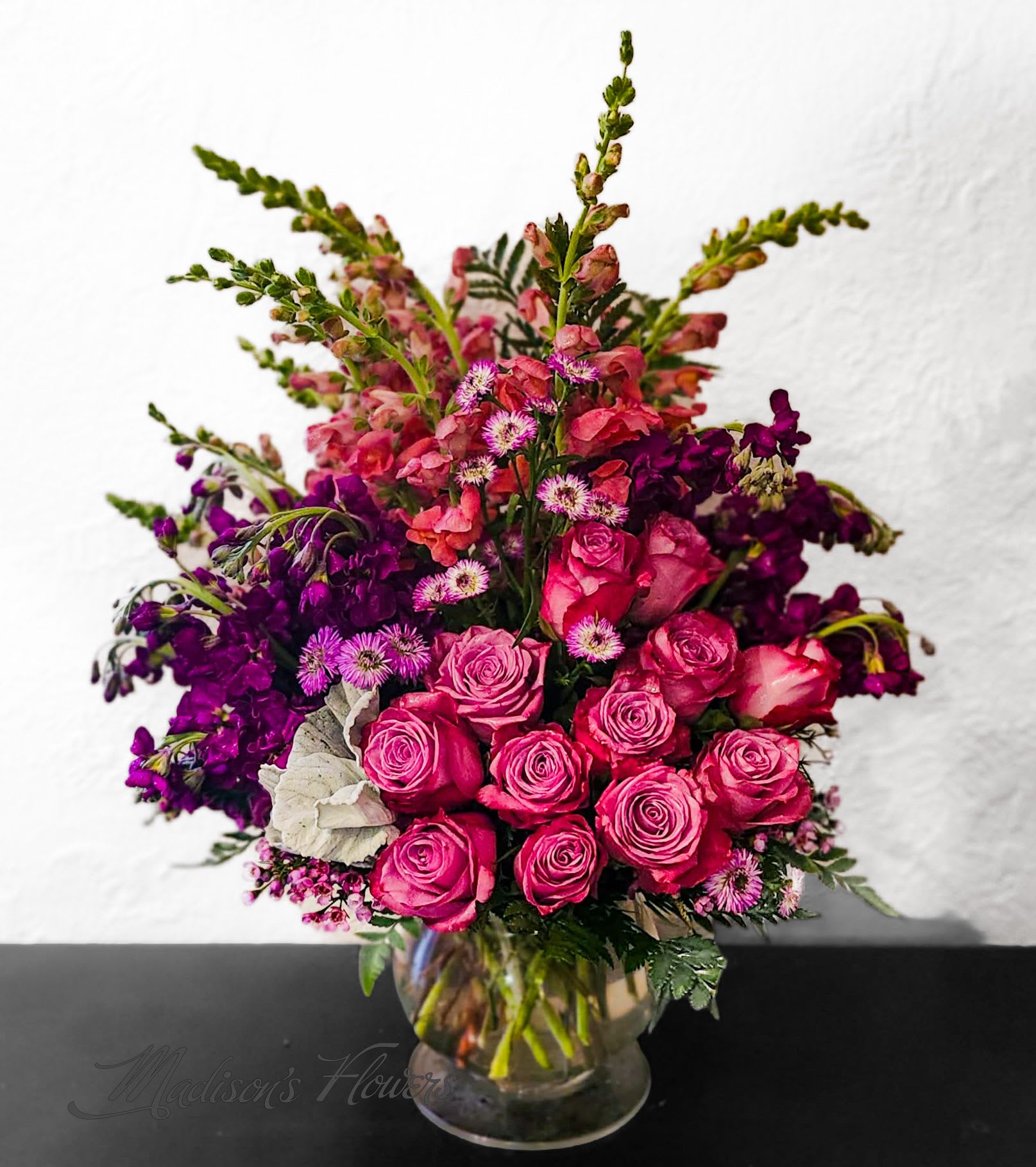 'Purple Passion' by Madison's Flowers - For the special individual that loves Purple. This specially designed arrangement combines flowers in every shade of purple from lilac to mauve. Grand in design and very luxurious. We will ensure the passion of purple stays alive with this one.