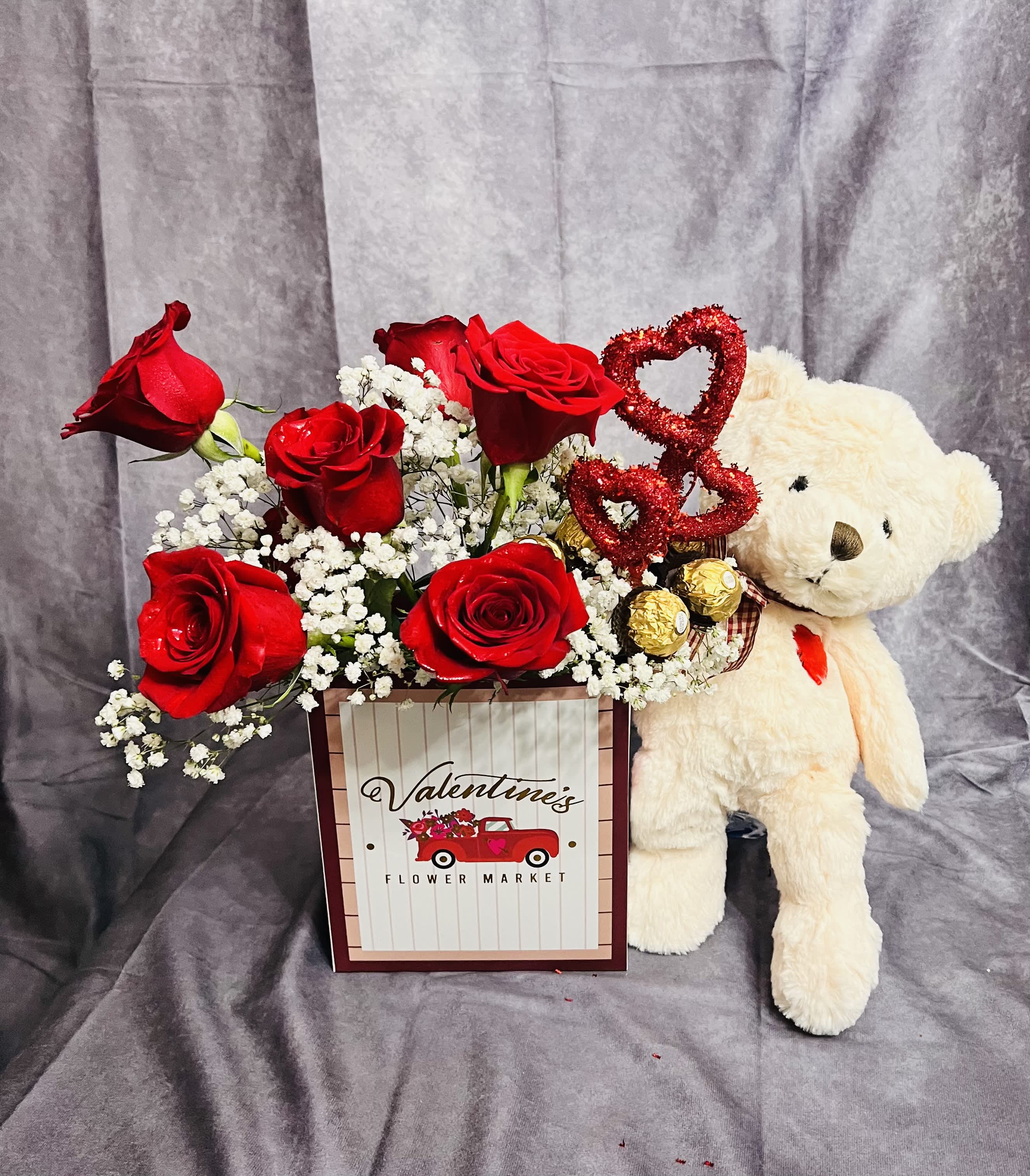 Bear in love - One dozen red roses or any combination color roses of your choice please specify in your order comments.  This order included White or brown teddy bear per your selection.  Six FERRERO ROCHER chocolate also included in this set.