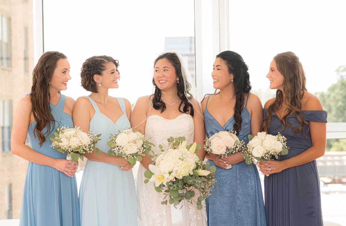  Bridesmaids Bouquet (Purity of love) Wedding  - White roses and mix in baby breath along with some greenery fillers. This order is from our Purity of love wedding package.  We also custom to your wedding theme color, please specify in comments. Price is for one bridesmaid bouquet.