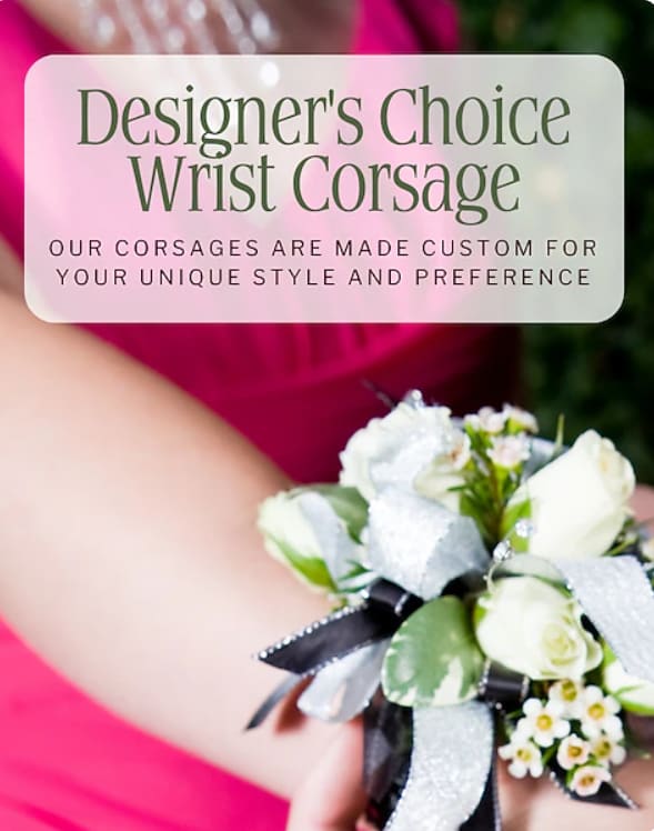 White wrist corsage with small roses and ribbon