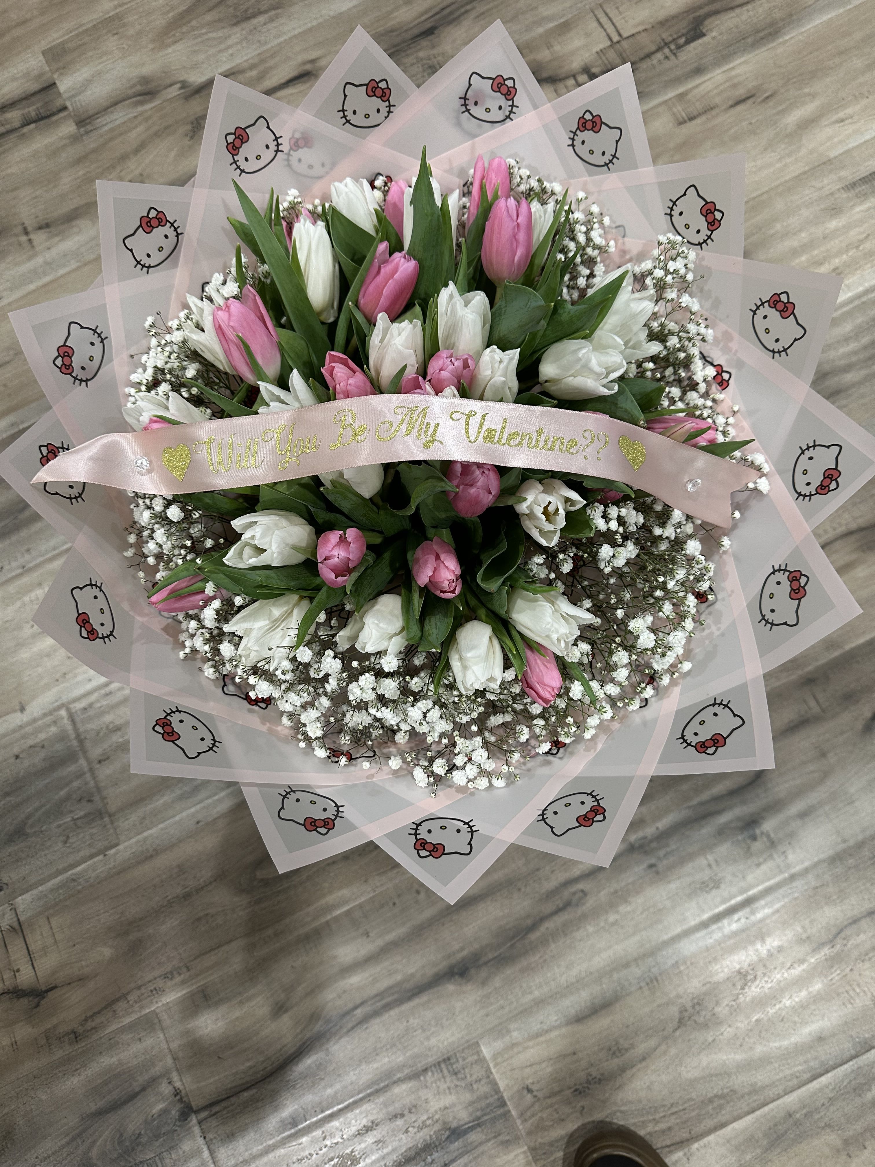 Pink and white tulip bouquet with a Valentine ribbon and Hello Kitty wrap