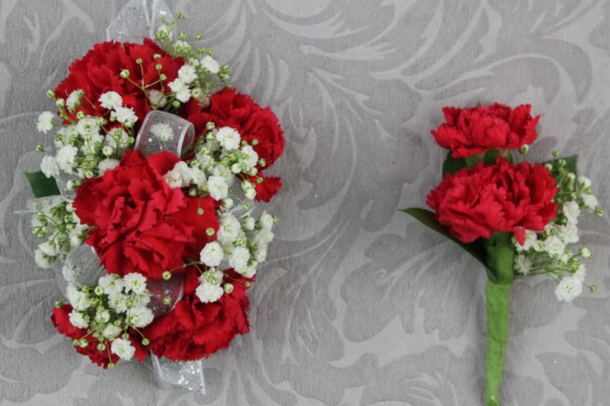 Corsage and Boutonniere Set Red Carnations and white ribbon - Corsage and Boutonniere Set with Red Carnations and white ribbon. Great for Graduations, Prom and Weddings.