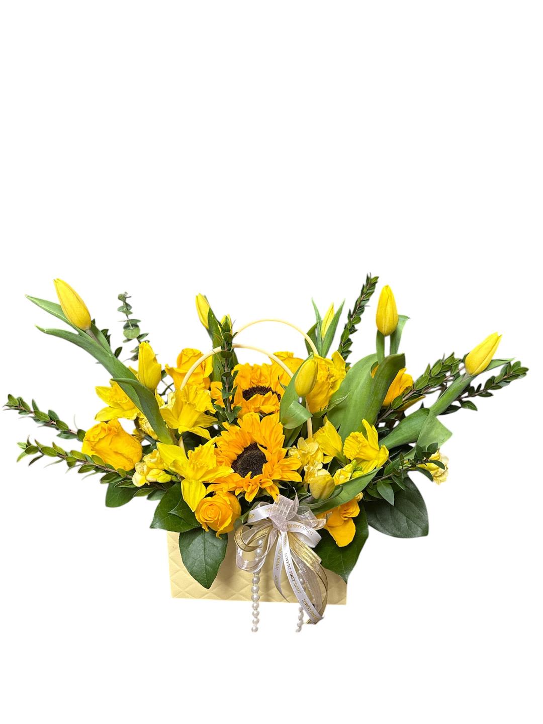 In yellow bag bouquet 131 - Please note that substitutions may be necessary due to availability. We will always preserve the overall style and color scheme, using items of equal or higher value.