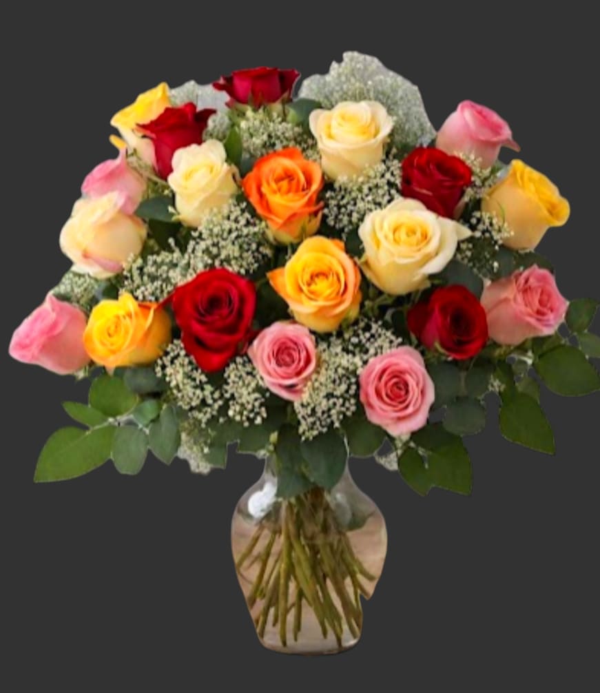 Bouquet of multicolored roses in a glass vase