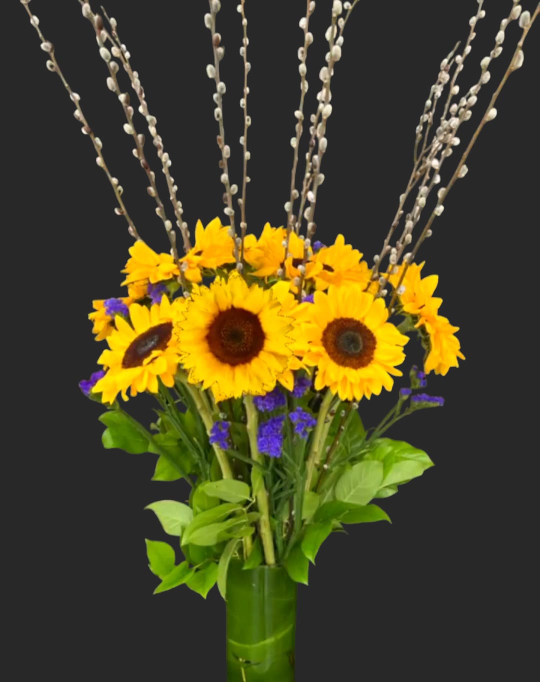 Sunflowers in a green vase with pussy willow branches