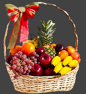 Fruit basket with grapes, apples, bananas, oranges, and a pineapple