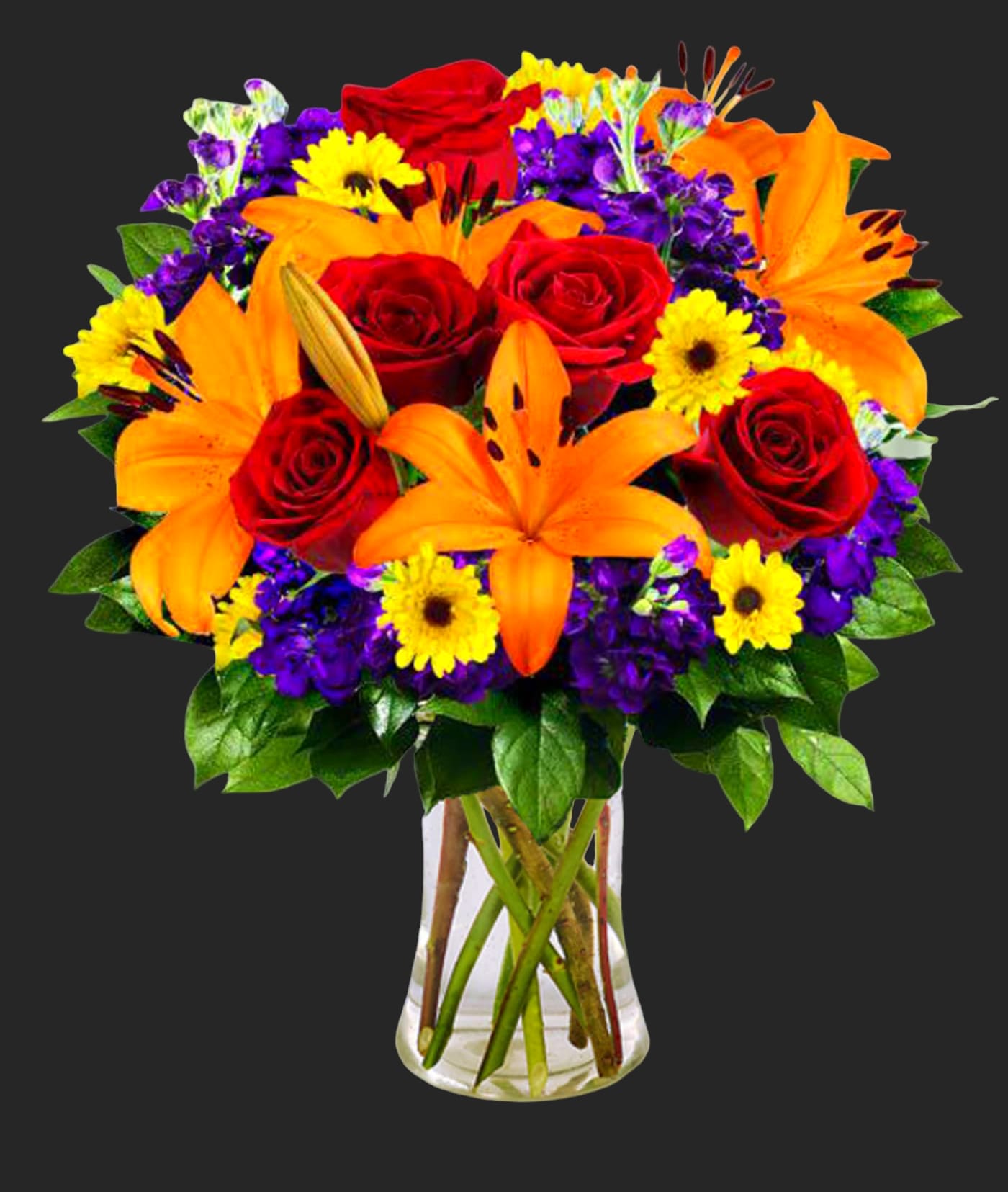 Bouquet of red roses, orange lilies, and yellow daisies in a clear vase