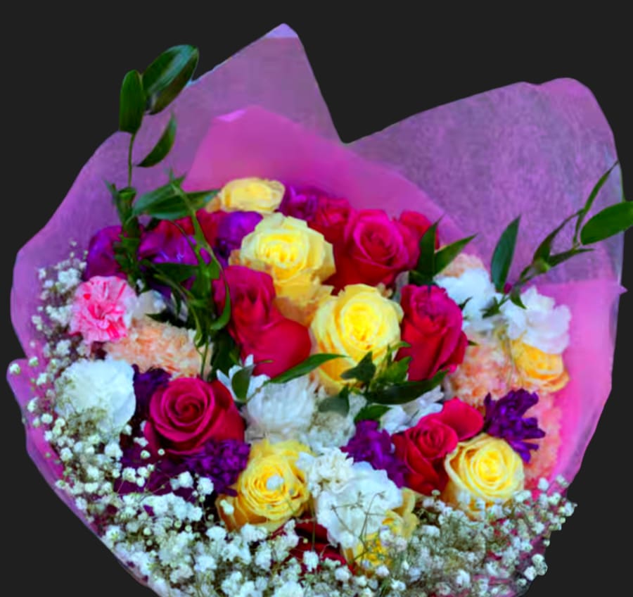Bouquet of pink, yellow, and white roses wrapped in purple paper