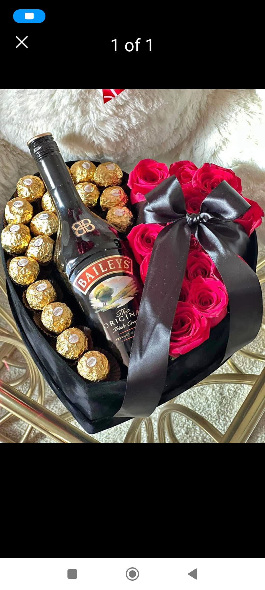 Heart-shaped gift box with pink roses, Ferrero Rocher chocolates, and a Baileys bottle