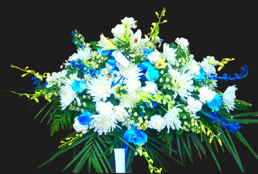 Large white and blue floral spray with lilies and daisies