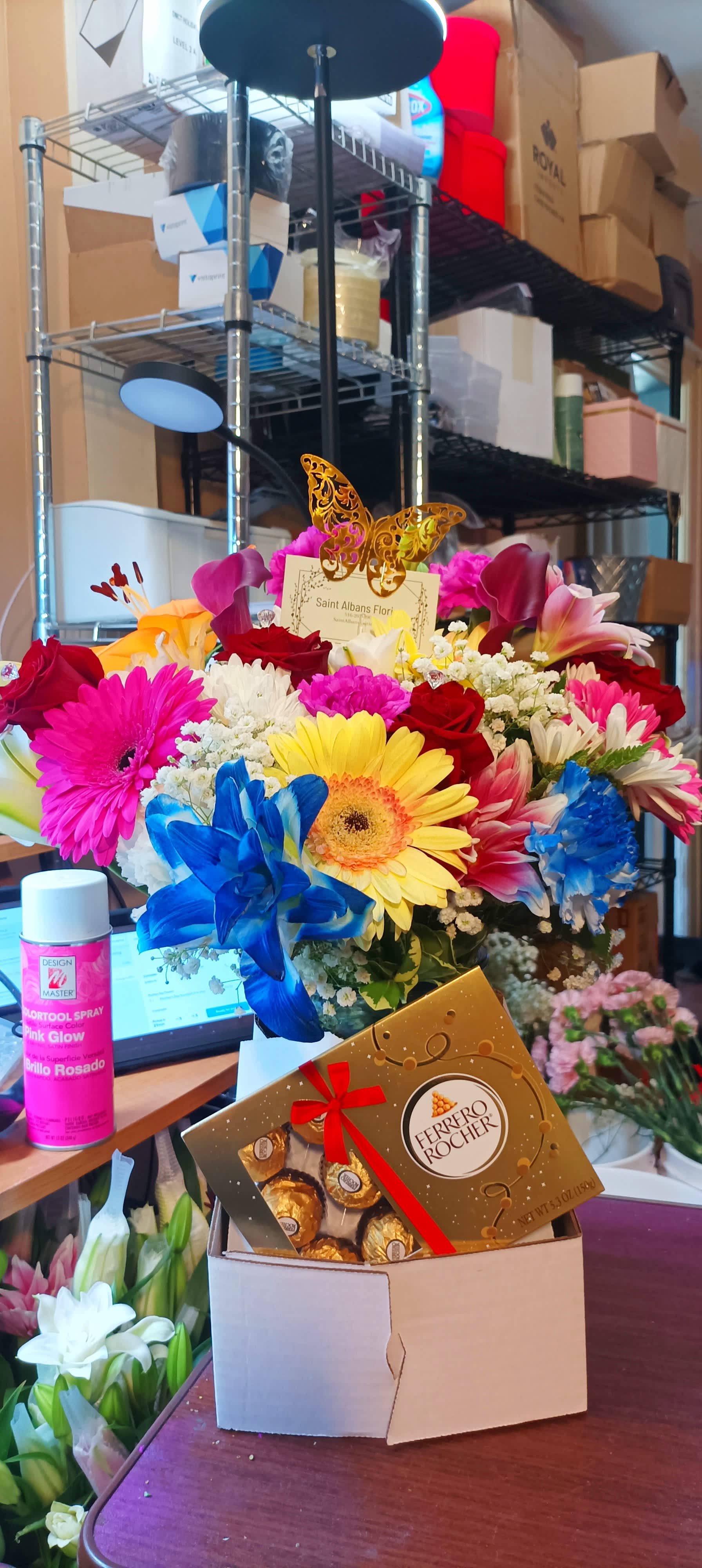 Bright mixed bouquet with a Ferrero Rocher box in front