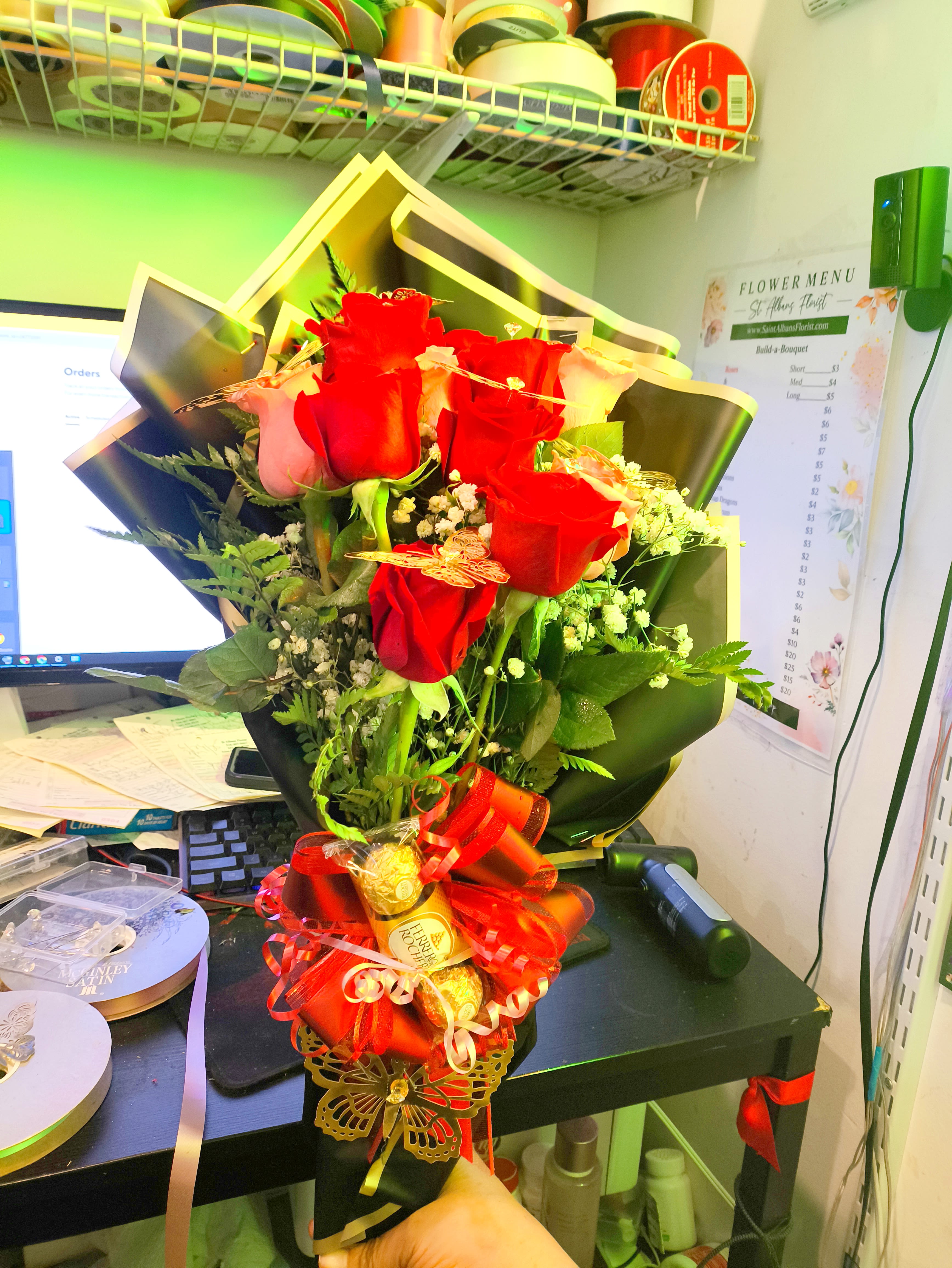 Bouquet of red roses with a Ferrero Rocher gift wrap
