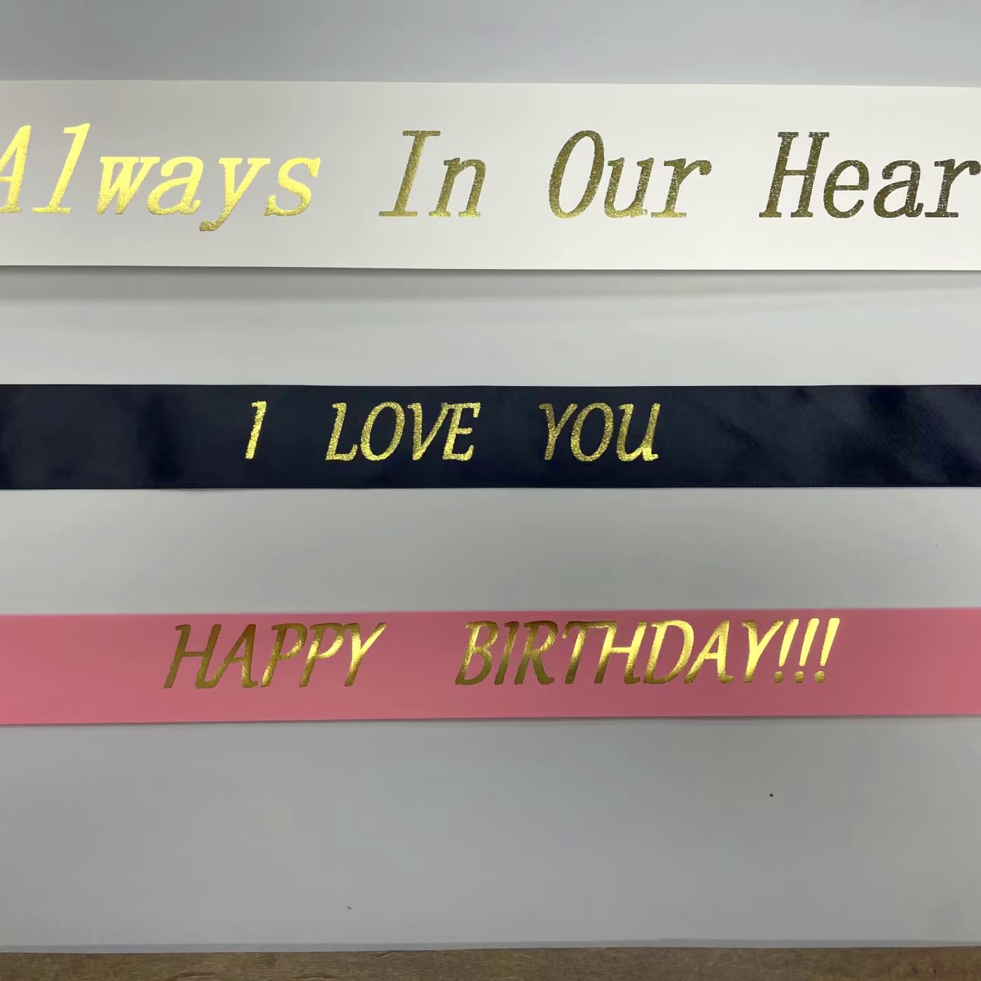 Decorative ribbons with gold lettering reading "I LOVE YOU" and "HAPPY BIRTHDAY!!!"