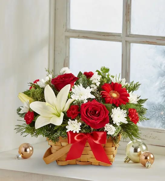 Fields of Europe Basket Christmas - Spread holiday cheer with our basket of blooms. Capturing the natural beauty of the European countryside, this freshly gathered arrangement is designed in signature Christmas colors. A joyful surprise for family &amp; friends; a charming centerpiece for a season of celebrating.