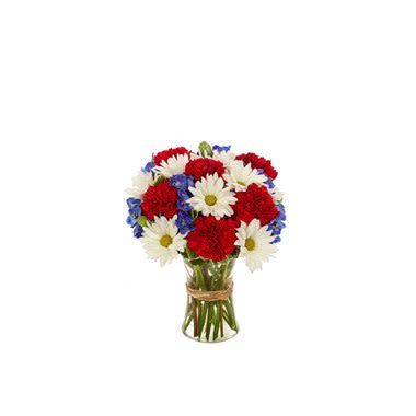 American Glory Bouquet - Displaying a glorious celebration of red, white and blue, this assortment of carnations, daisies and delphinium in a clear gathering vase expresses patriotic feelings that are perfect for gift-giving and for decorating your own home. Measures 13”H X 9”L.