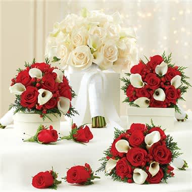 Holiday And White Personal Package (1 White Bridal Bouquet, 3 Bridesmaid Bouquets And 4 Boutonnieres) - Make your wedding day unforgettable with these hand-designed, holiday-themed arrangements that arrive fresh from our premier florists. This festive collection includes:  1 White bridal bouquet, handcrafted from red roses, 8 white Calla lilies, red hypericum and assorted seasonal greens such as noble, fir, white pine, cedar and holly, tied with a white satin ribbon; you may also choose an all-white bridal bouquet 3 holiday bridesmaids bouquets, featuring red roses, white miniature Calla lilies, red hypericum and assorted seasonal greens, tied with a white satin ribbon 1 Grooms boutonniere featuring a single stem red rose and accented with Monte casino and red hypericum 3 Groomsmens boutonnieres featuring a single stem red rose, accented with Monte casino and red hypericum Orders must be placed two weeks in advance to allow for processing