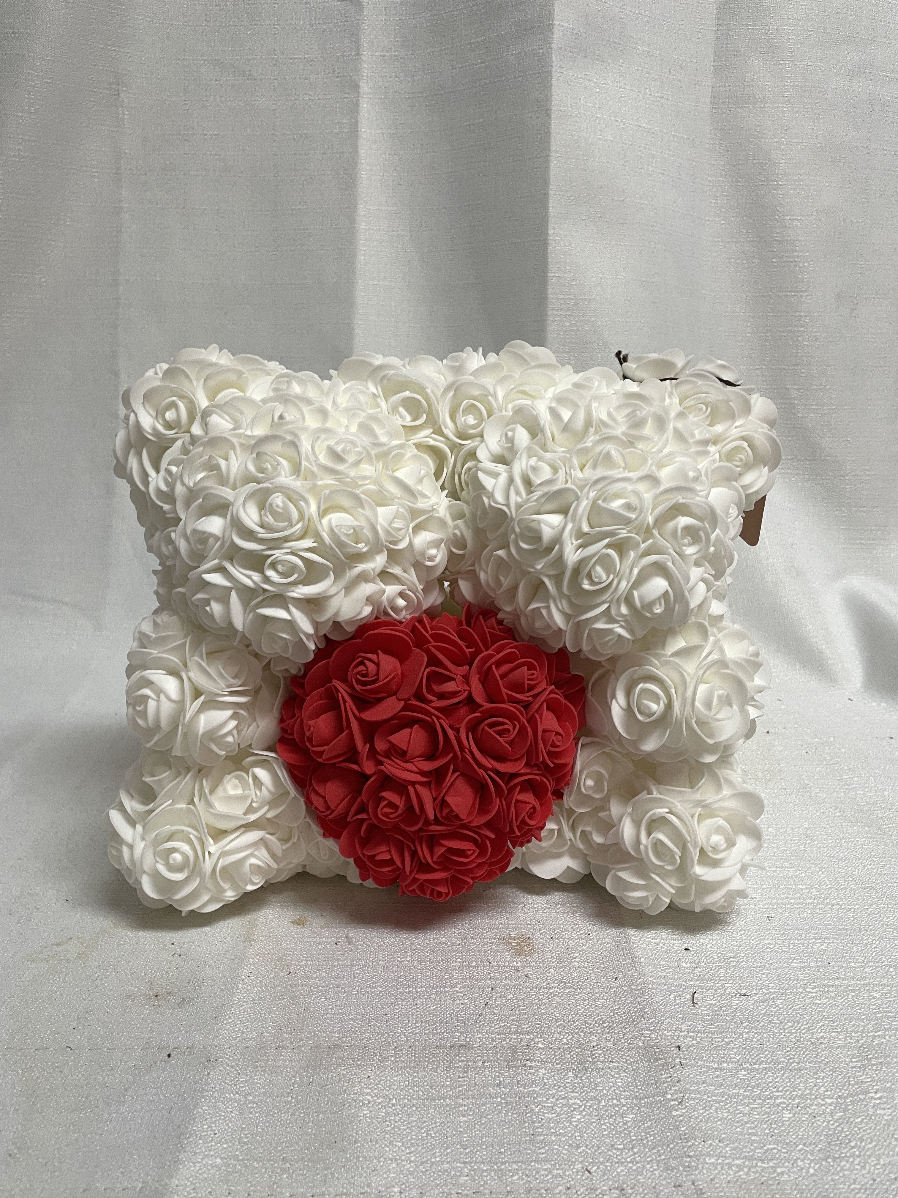 White rose teddy bear with a red heart on the front