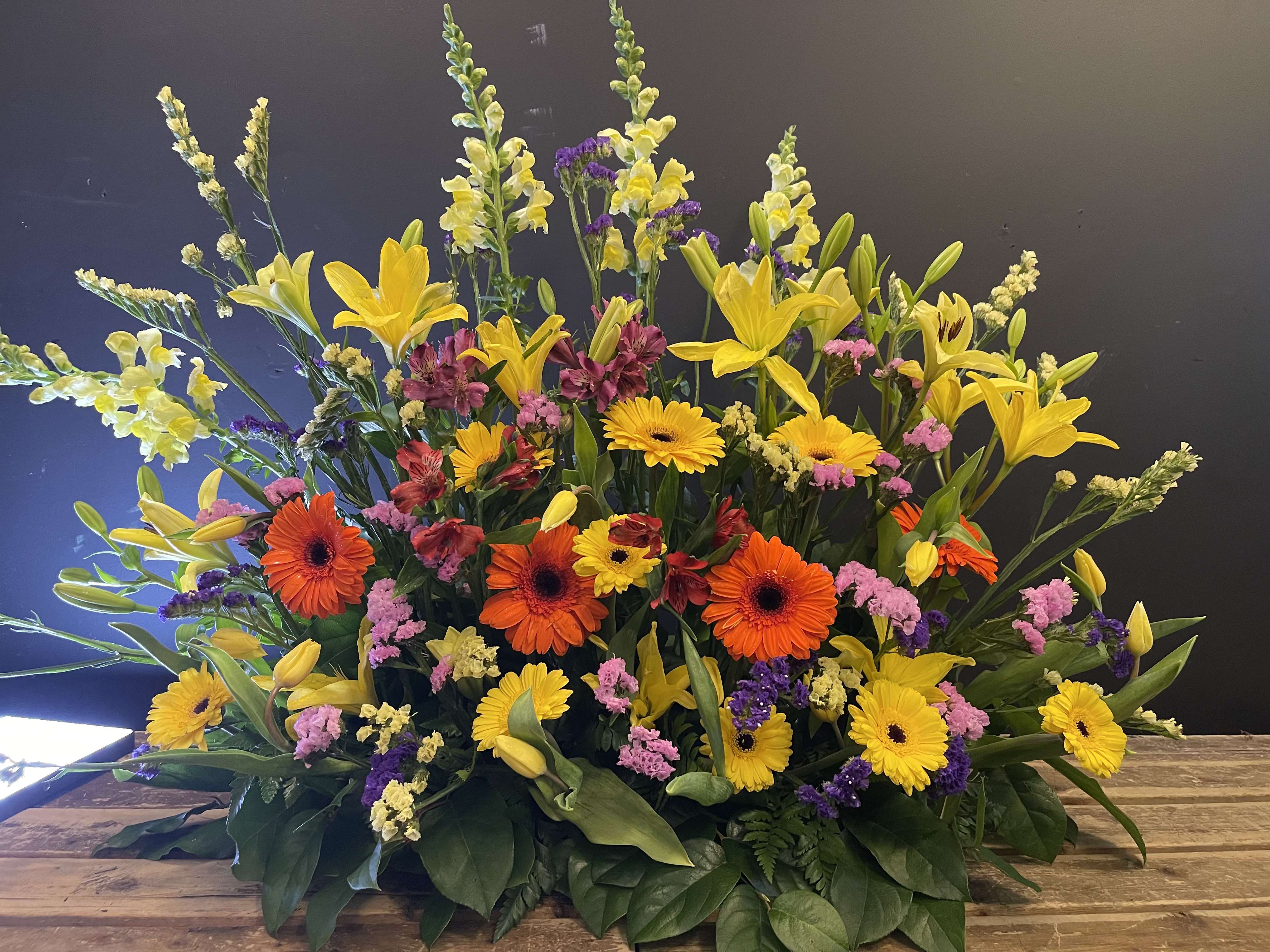 Large mixed bouquet with yellow lilies and orange gerbera daisies