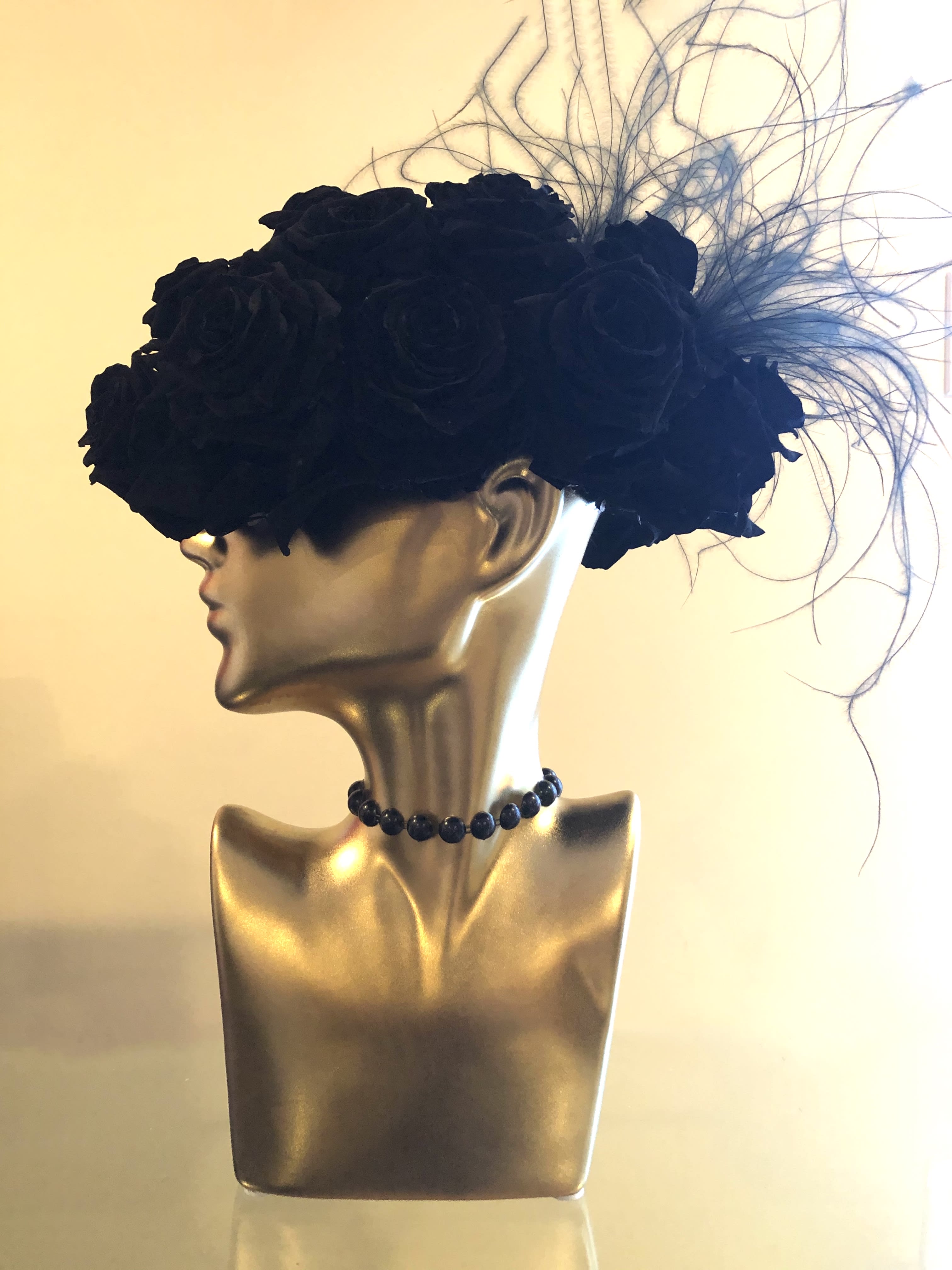 Black rose headpiece on a mannequin bust