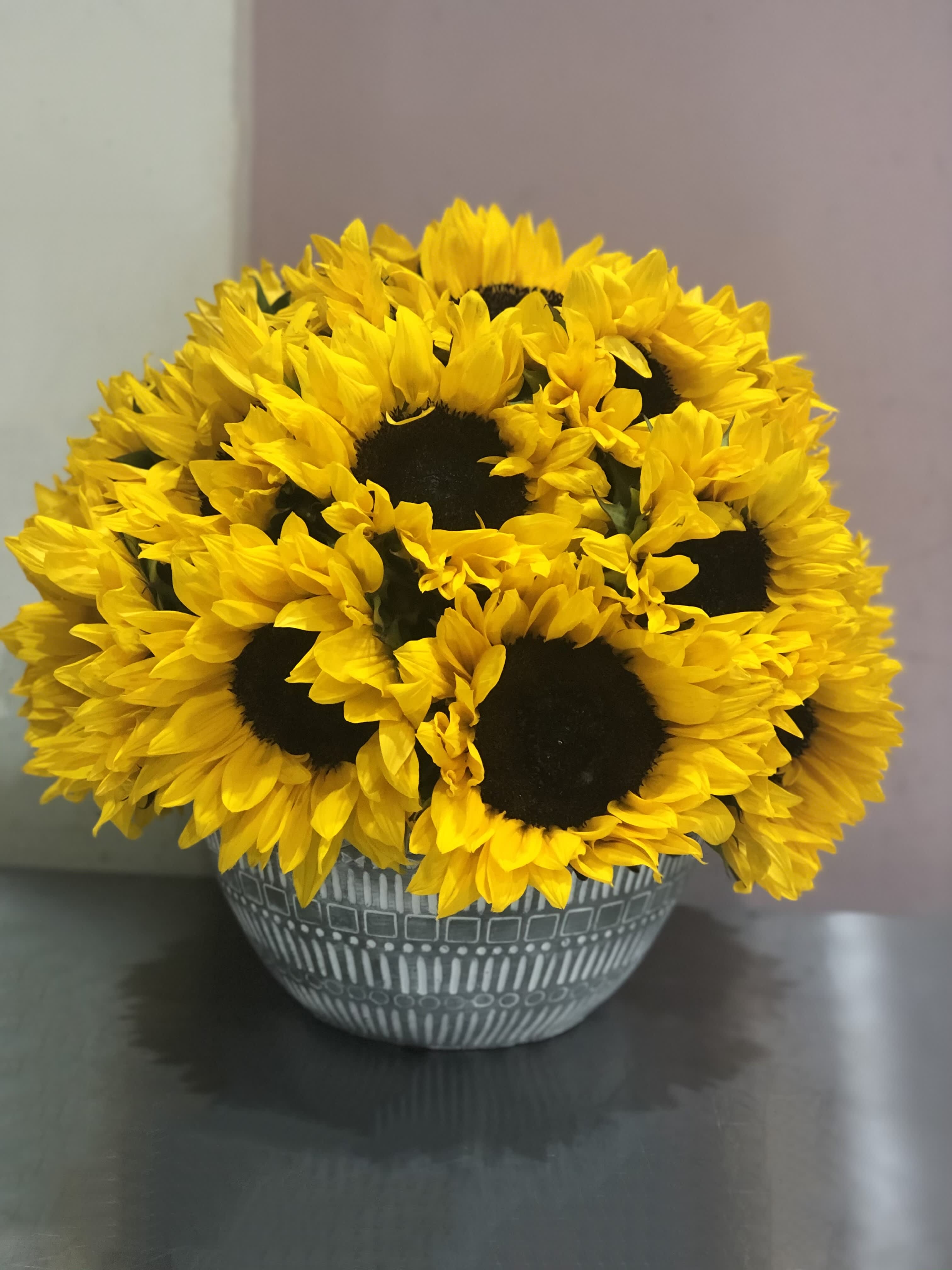 Sunshine  - Sunny Sunflowers in a ceramic vase, bringing a cheerful touch of nature indoors.
