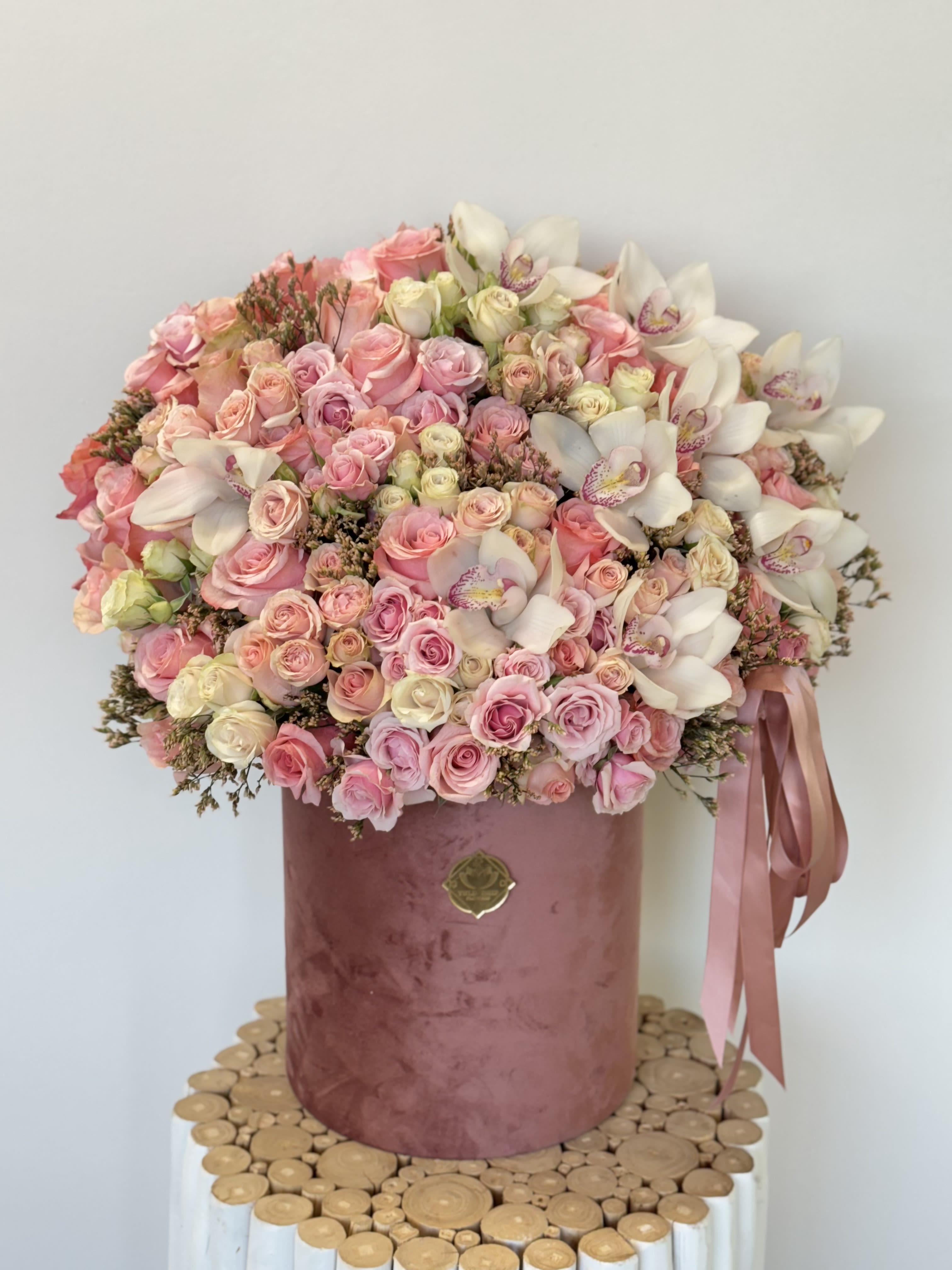 Large pink and white bouquet in a velvet hatbox