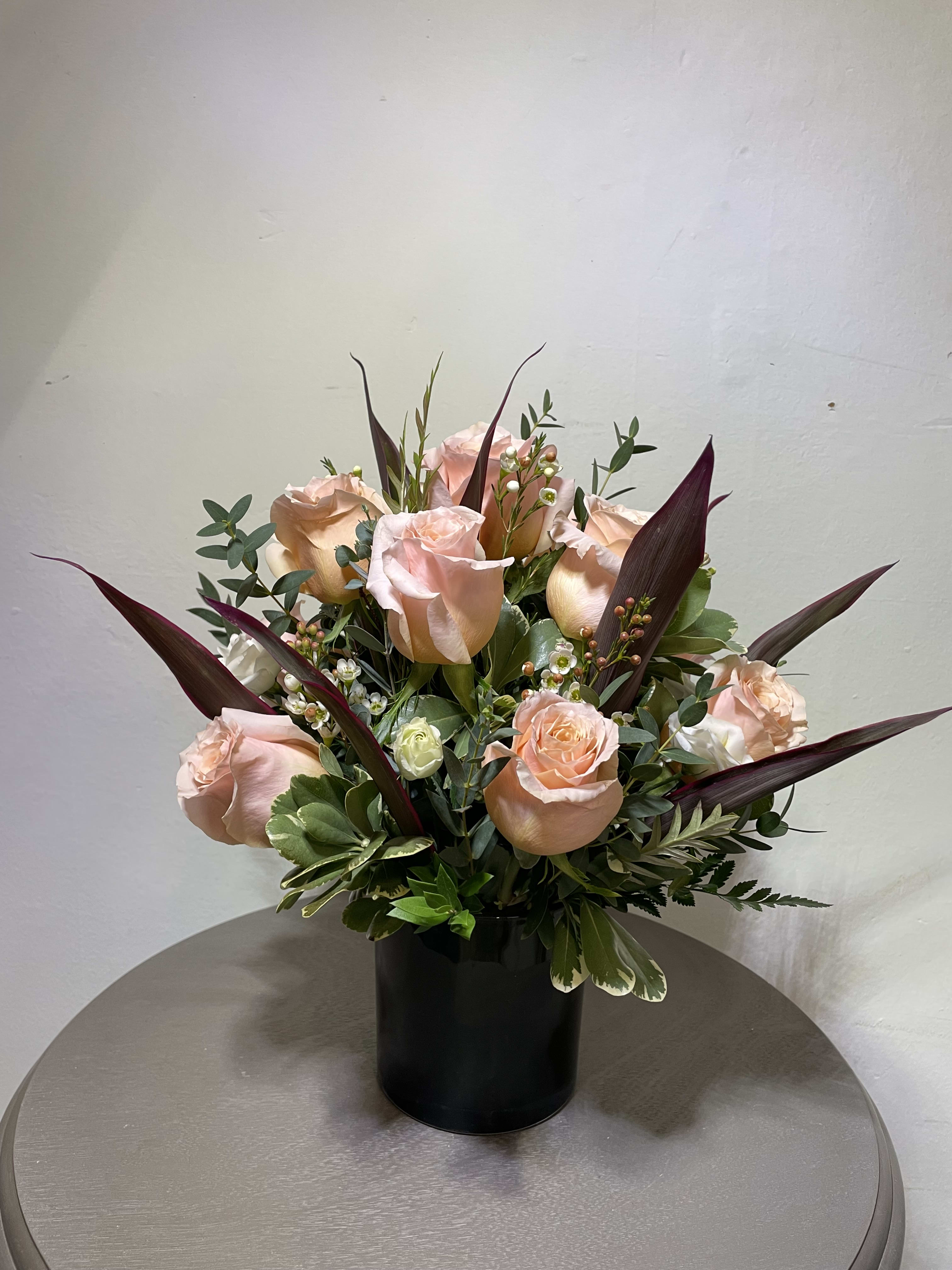 Sweet &amp; Subtle  - This arrangement includes pink roses, white roses, white spray roses, pink carnations, and dusty miller. Sweet &amp; Subtle is the perfect gift for a birthday, thank you, or just because.   VARIES IN COLOR &amp; FLOWERS AS WELL