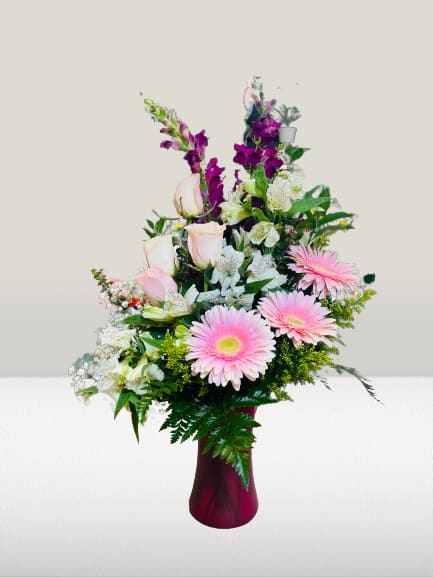 Blushing Fields  - This spring bouquet is the perfect gift to freshen up any home or office. This arrangement contains Roses, Lilies, Carnation, Gerbera and other seasonal blooms. This is a great gift for a Birthday, Mother's Day, Thank You, or Just Because. 