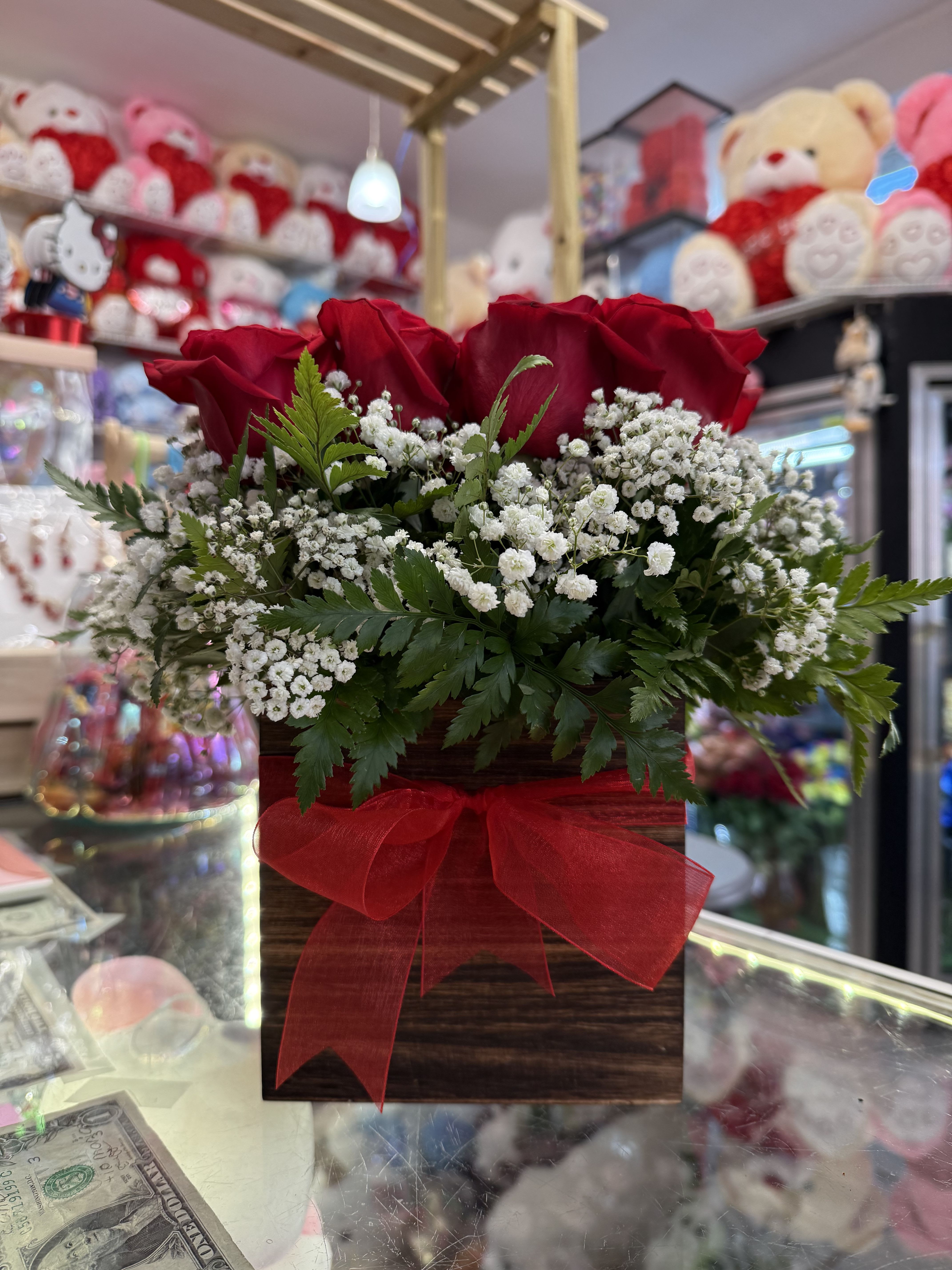 Rustic Rose  - This eye-catching arrangement offers a modern twist on the classic dozen. Rustic Rose makes a great gift for Valentine's Day, a birthday, or just to let someone know you're thinking of them.