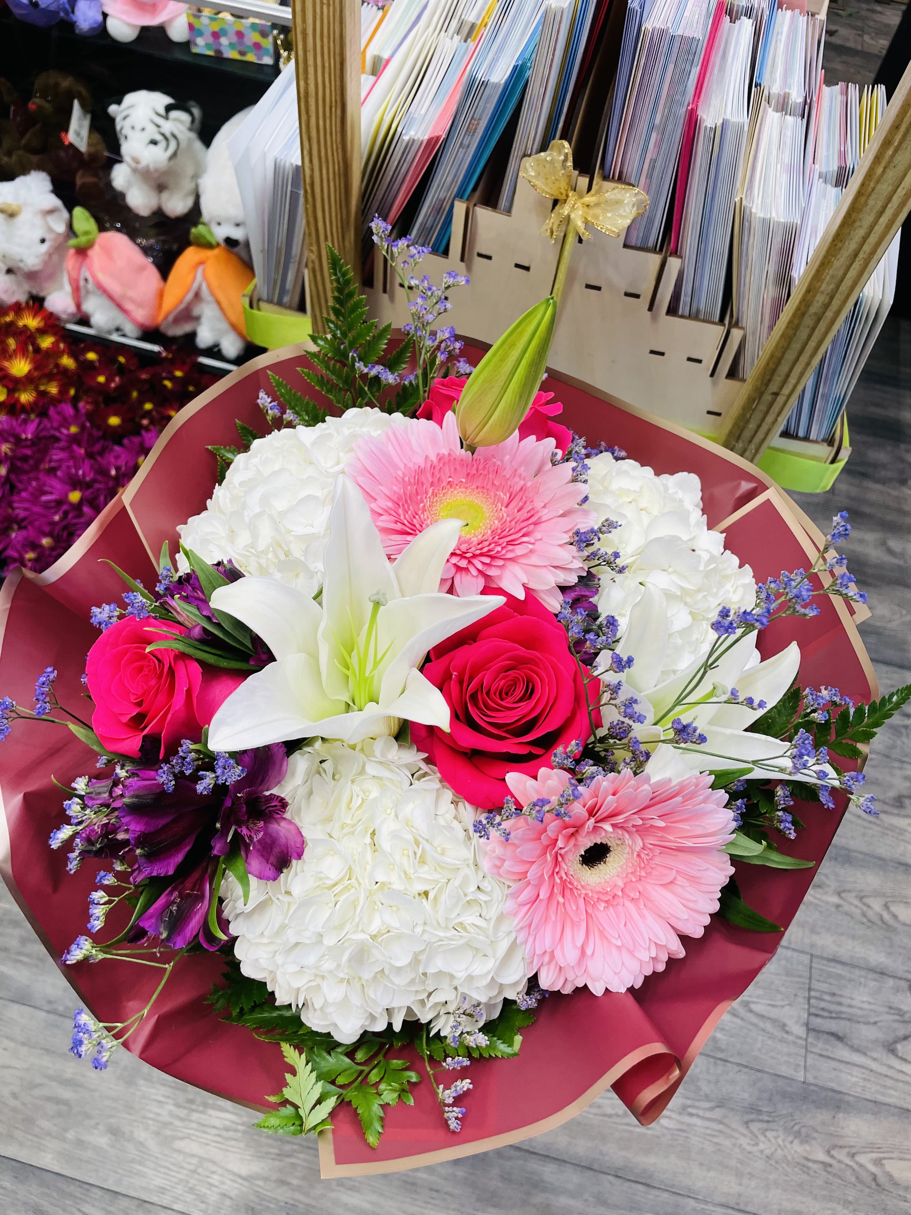 Bouquet of pink roses, white lilies, and pink gerbera daisies