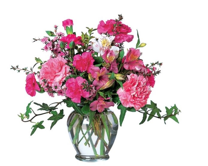 Pink mixed flower arrangement in a clear glass vase