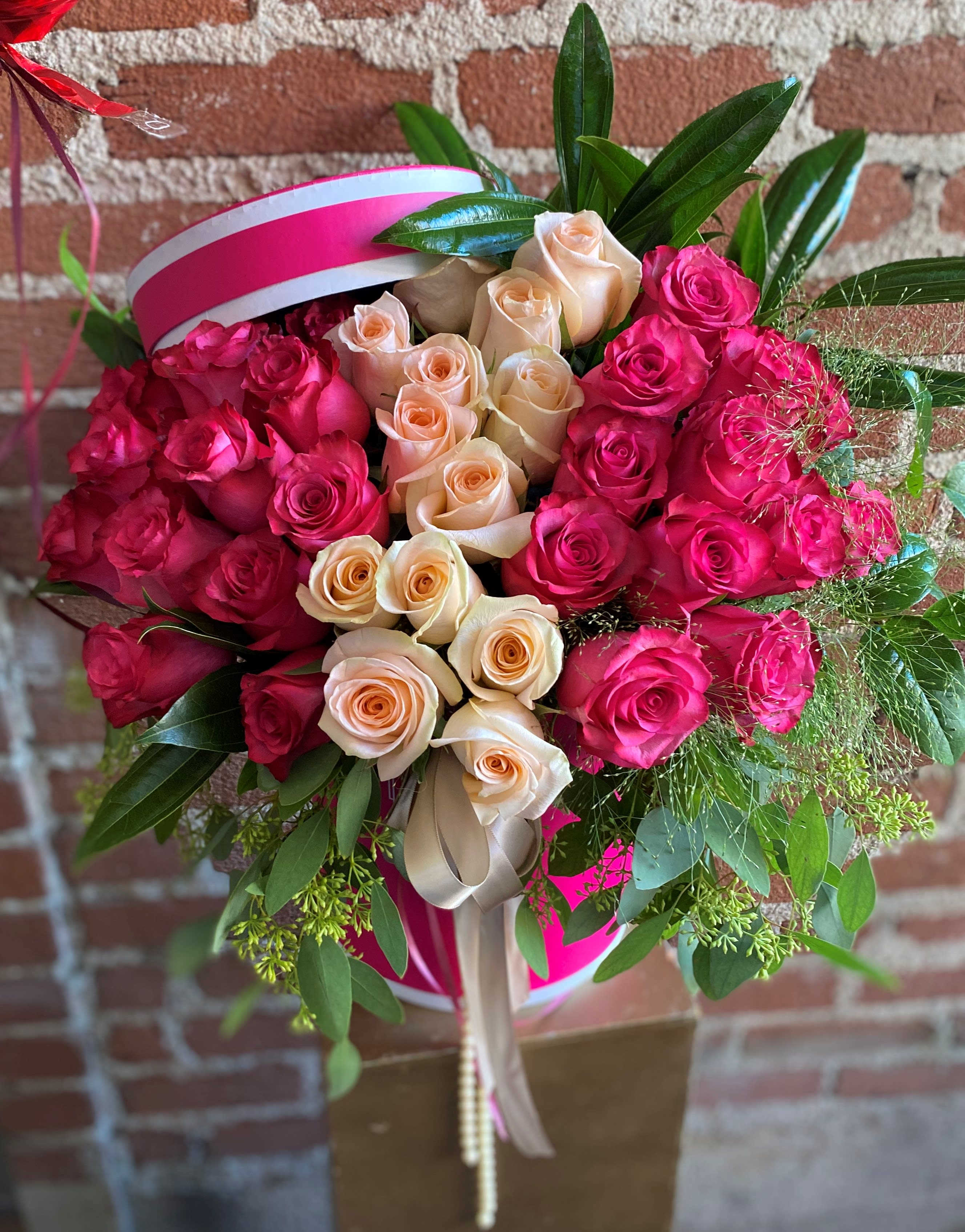 Pink Dreams - Silver Lake Florist - This beautiful arrangement is designed to deliver happiness to a loved ones day. Filled with beautiful Pink and White Roses and customized to perfection, this arrangement is a showstopper! If you want to turn heads then this is the arrangement for you!