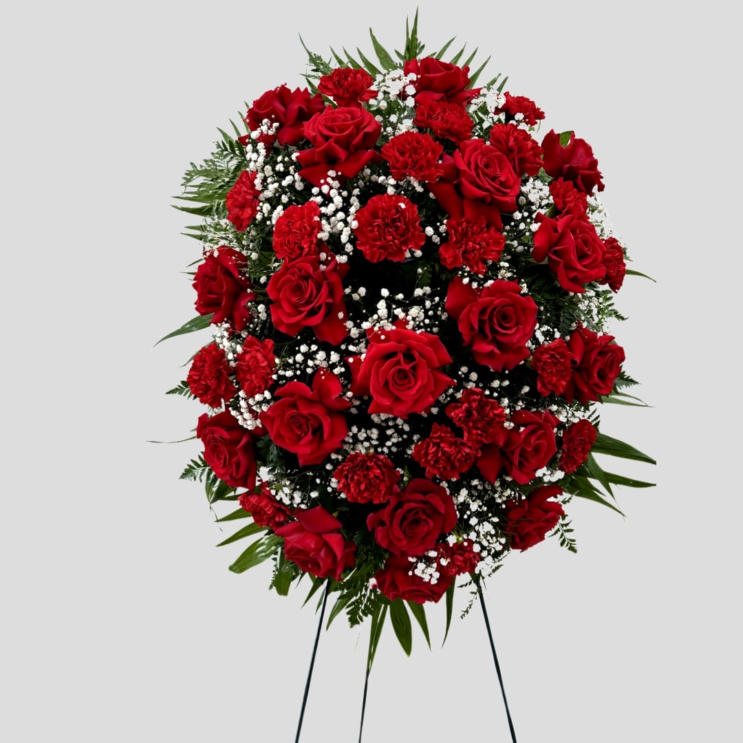 Standing spray of red roses and carnations with white baby's breath