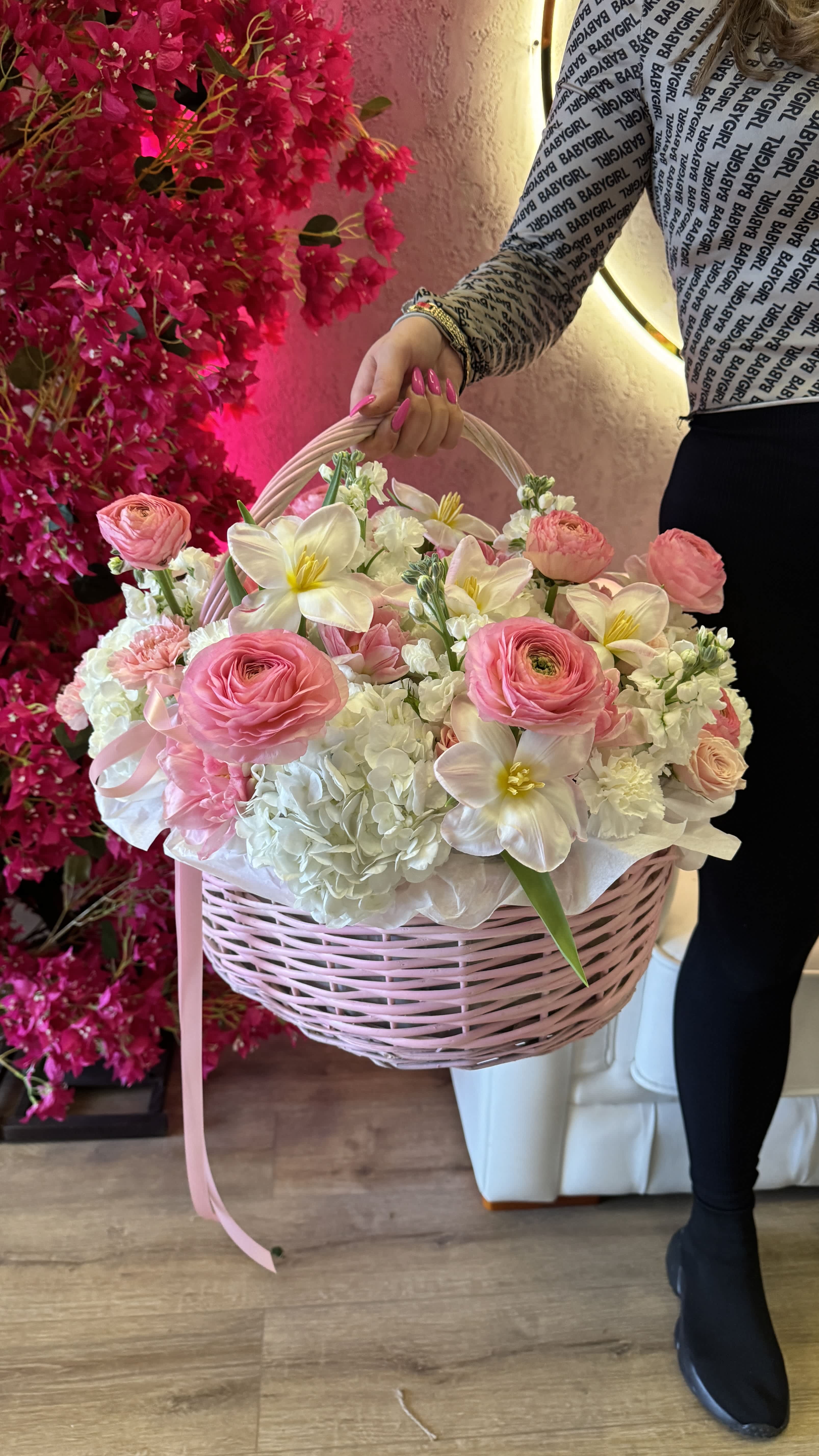 Pink and white flower basket with a ribbon handle