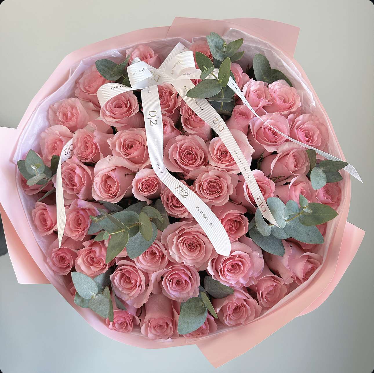 Roseh - This stunning bouquet features 50 gorgeous pink roses ,symbolizing love,admiration,and gratitude.Each rose is carefully hand-selected and arranged to create a breathtaking display of beauty and elegance.