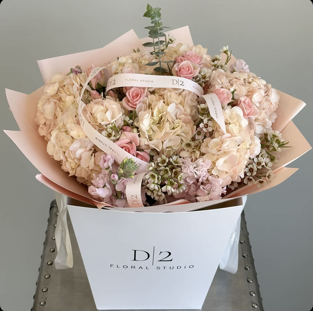Blush pink and cream bouquet in a white box with ribbon