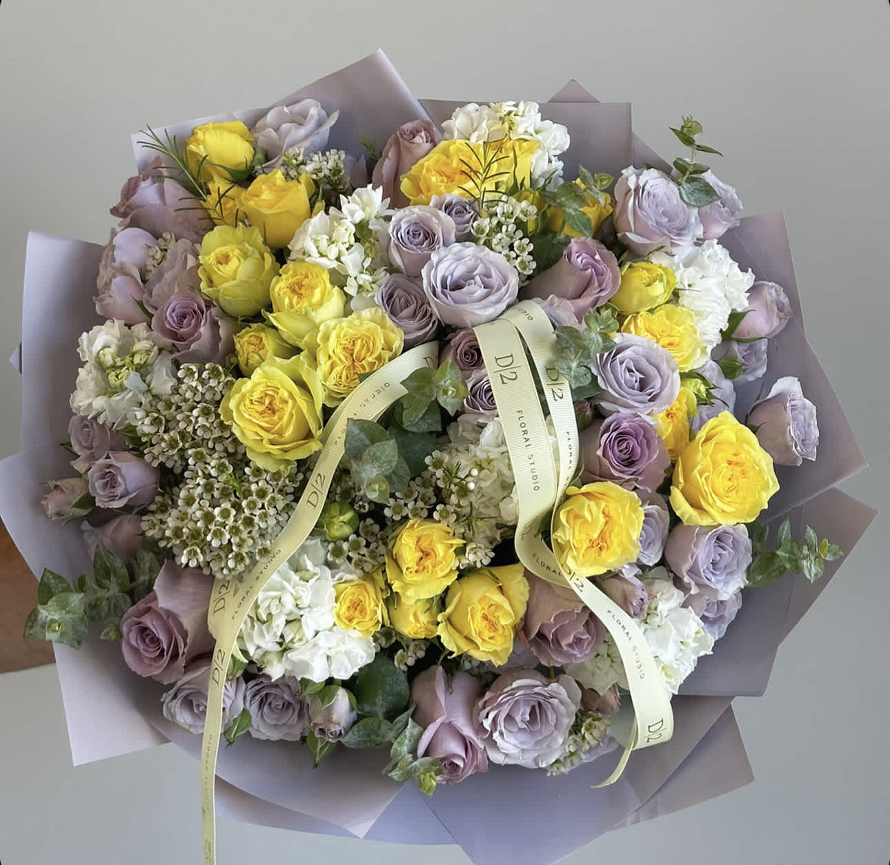 Summertime - This vibrant bouquet is a stunning combination of bright yellow and rich purple spray roses. the cheerful yellow roses bring a burst of sunshine to the arrangement, while the deep purple roses add a touch of drama and sophistication.Perfect gift to lighten up your loved one's day.