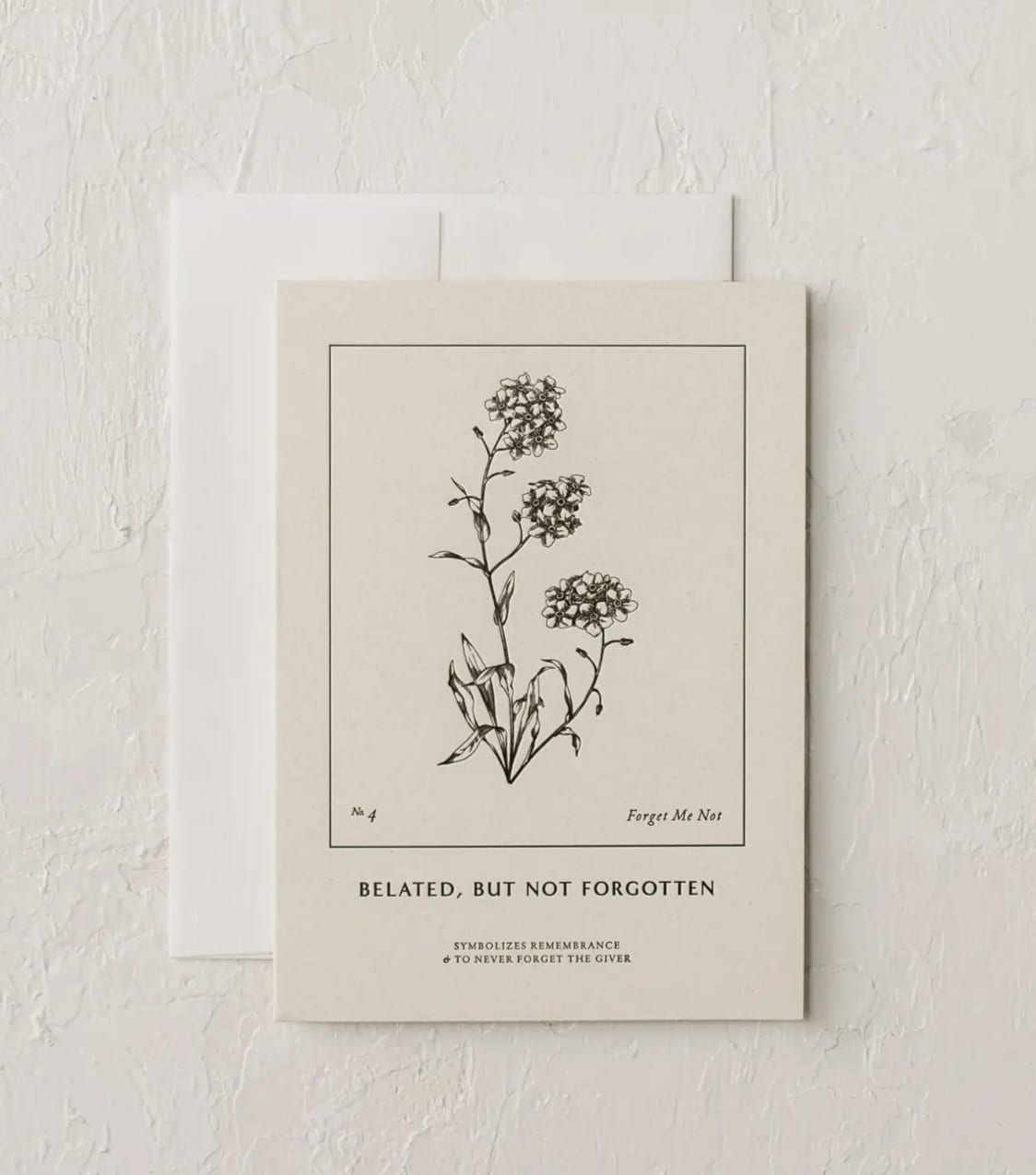 A botanical card with a black line drawing of forget-me-nots