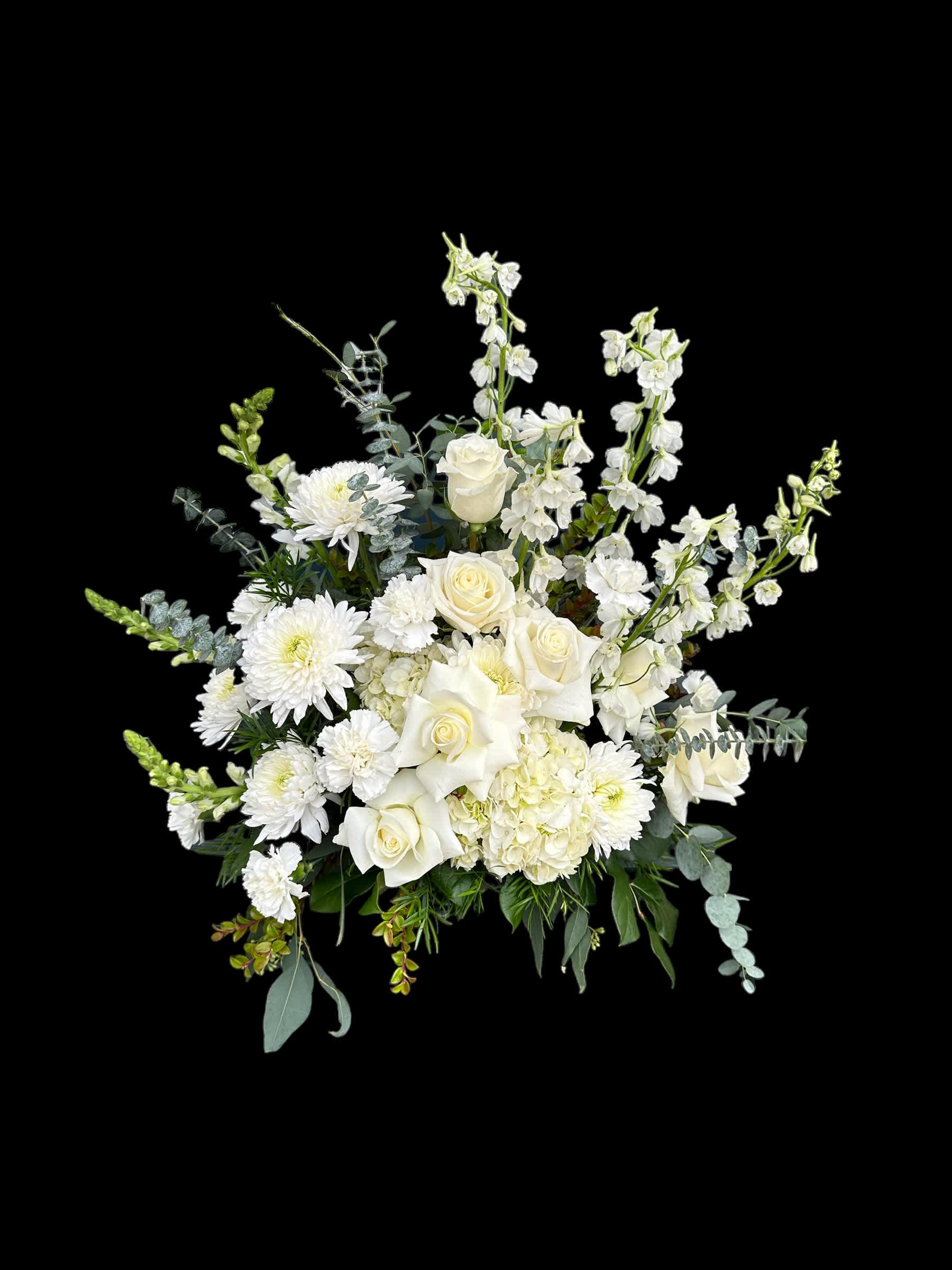 White roses and chrysanthemums arranged with tall white blooms