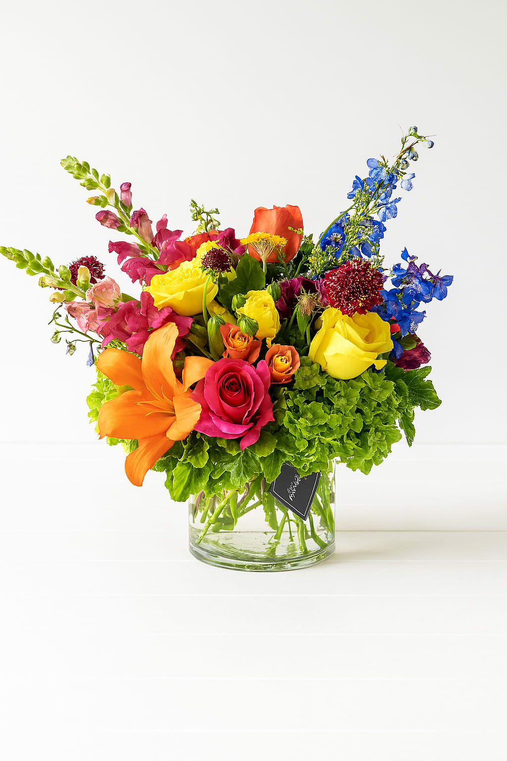 Colorful mixed bouquet in a clear glass vase
