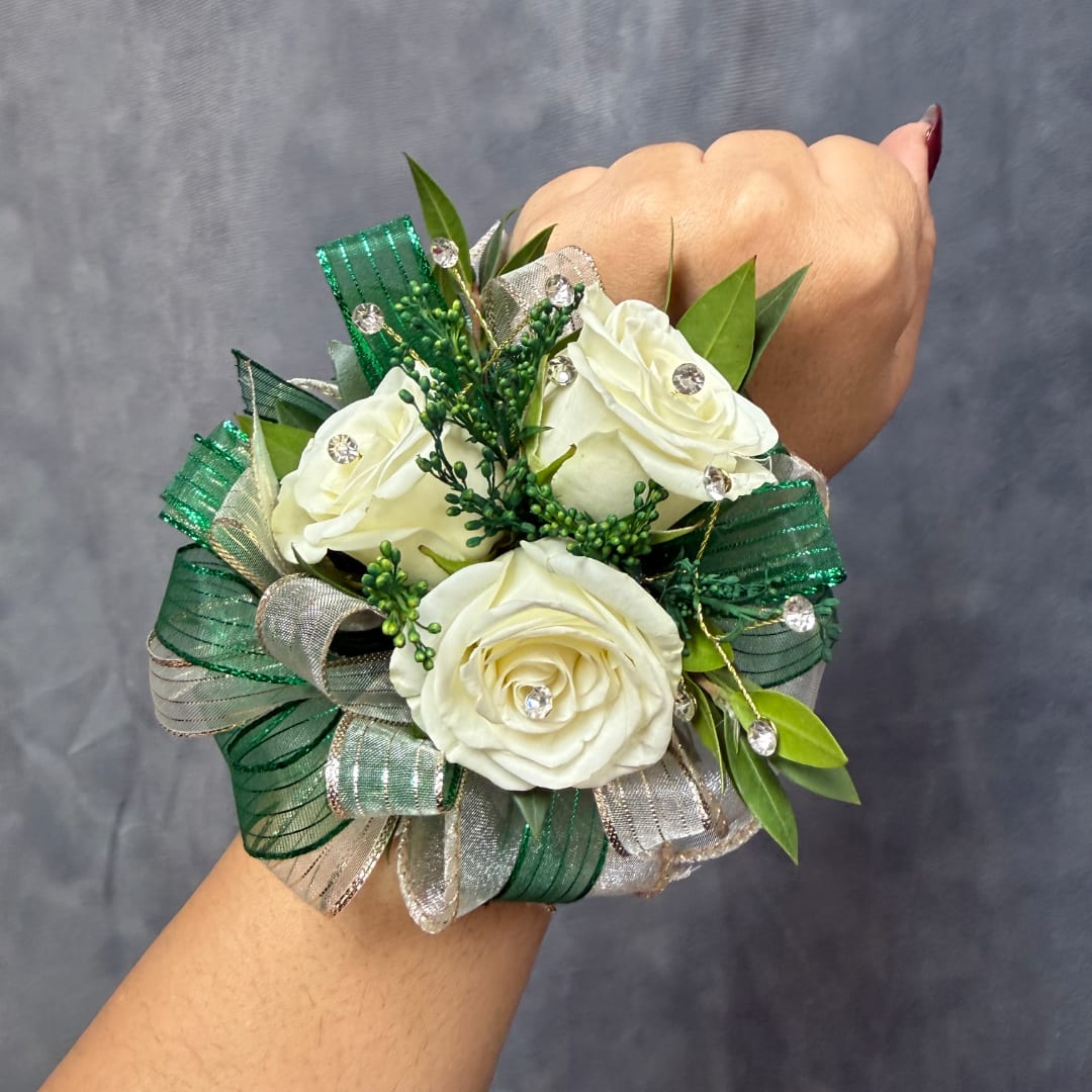 White rose wrist corsage with green and silver ribbon