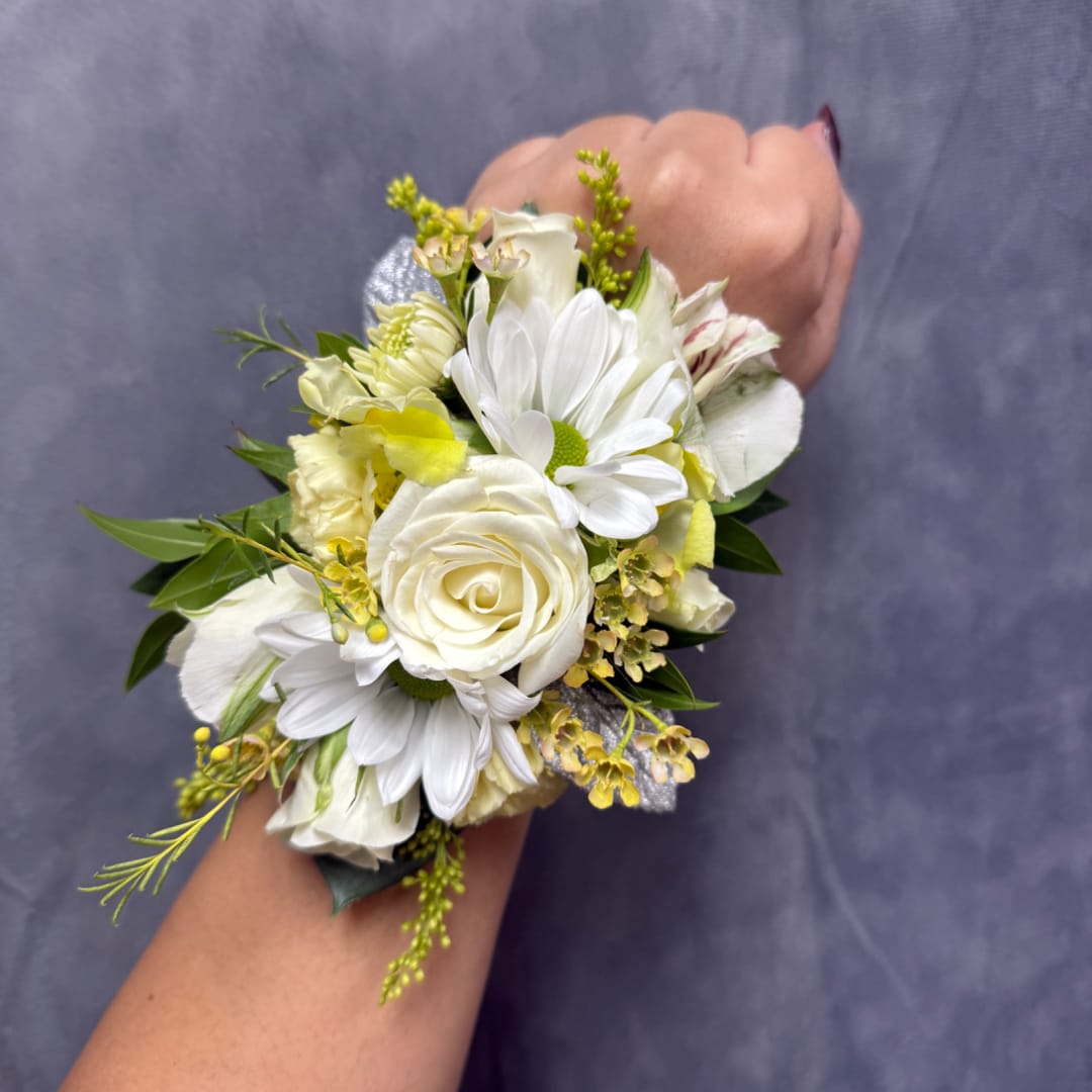 White floral wrist corsage with daisies and a rose